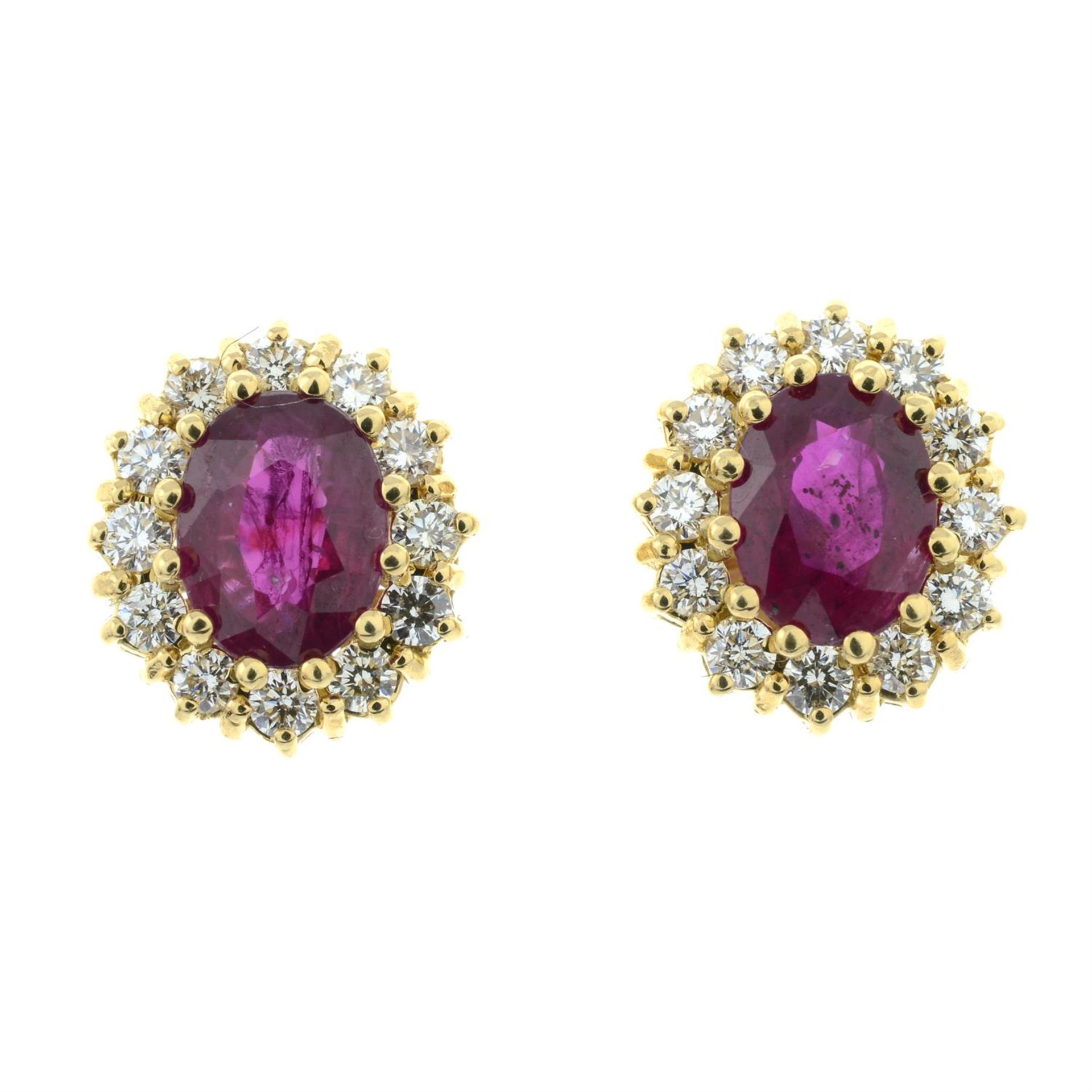 A pair of ruby and brilliant-cut diamond cluster earrings.