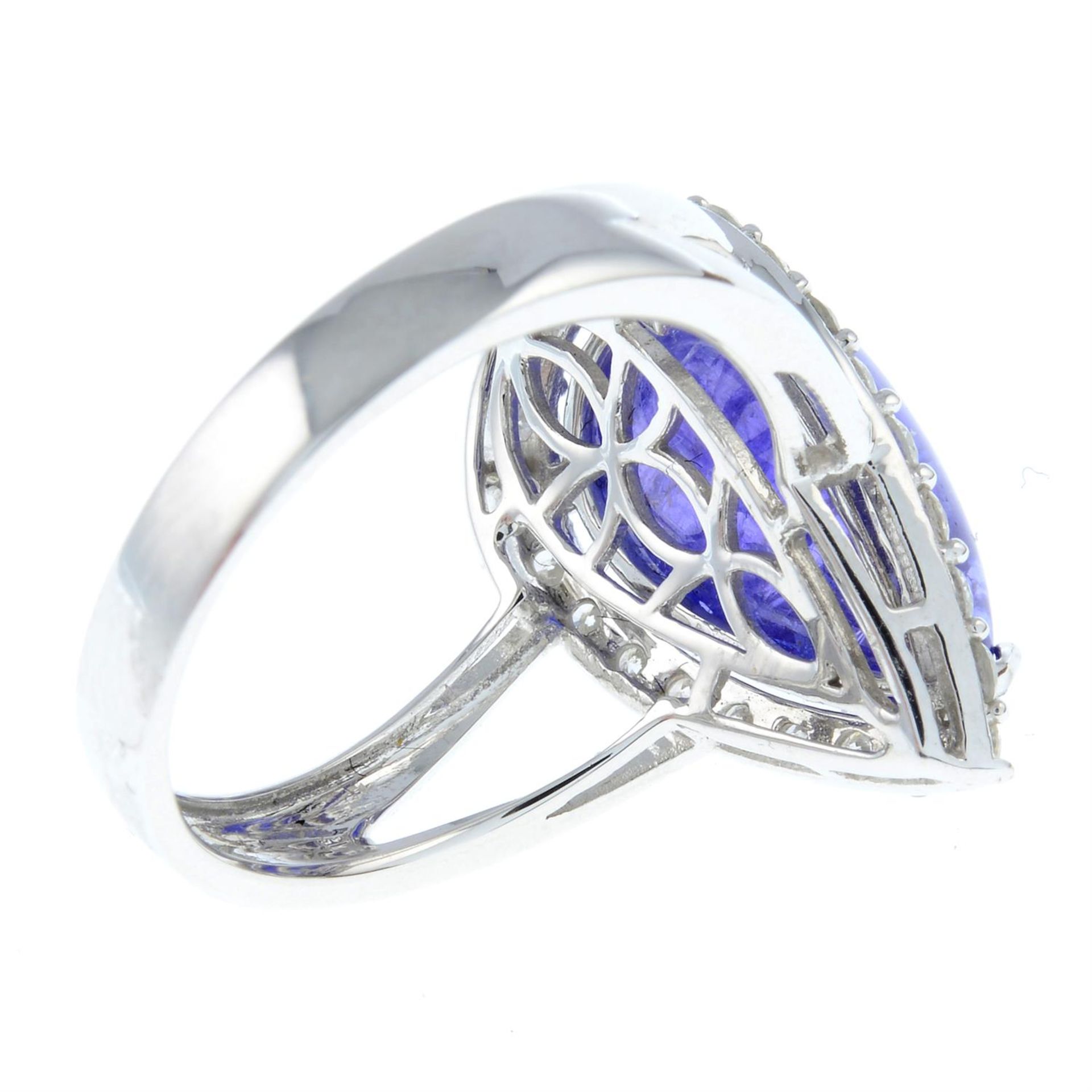A tanzanite cabochon and diamond cluster ring. - Image 2 of 5