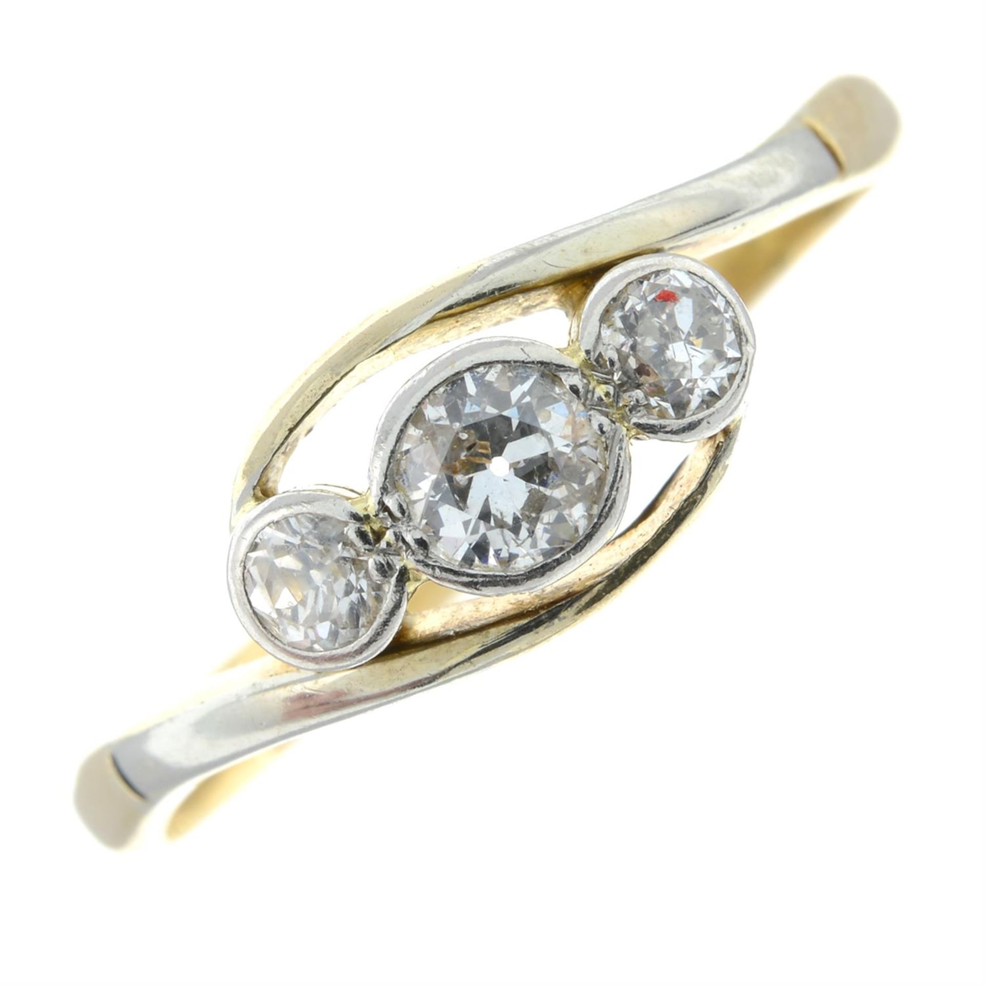 An early 20th century 18ct gold old-cut diamond three-stone ring.