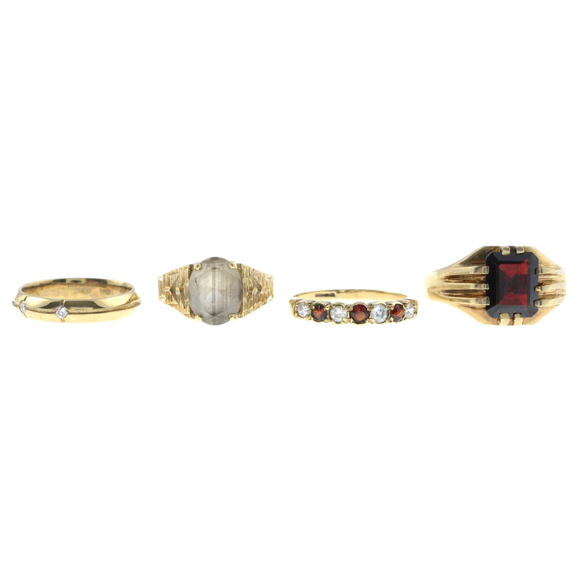 Four gem-set rings.