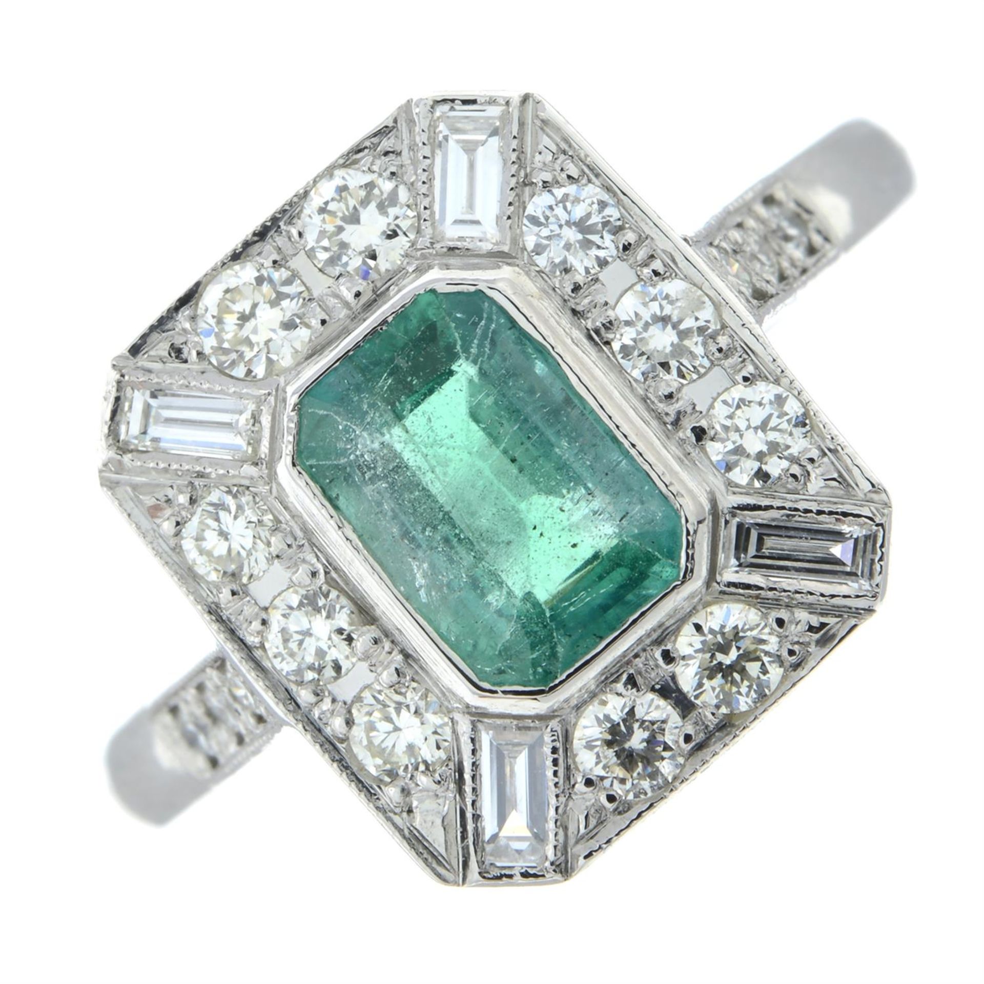 An emerald and vari-cut diamond dress ring.