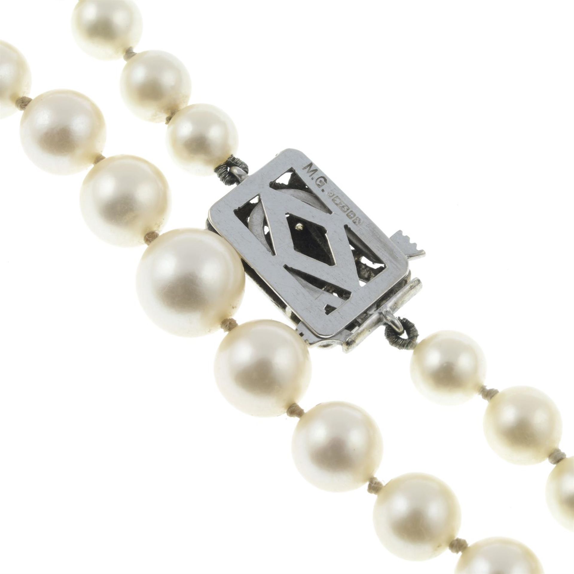 A slightly graduated cultured pearl single-strand necklace, with 9ct gold diamond floral clasp. - Image 3 of 3