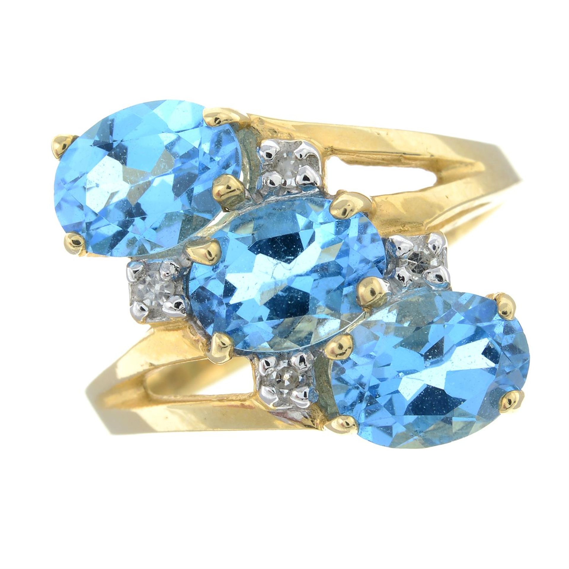 A blue topaz and diamond dress ring.