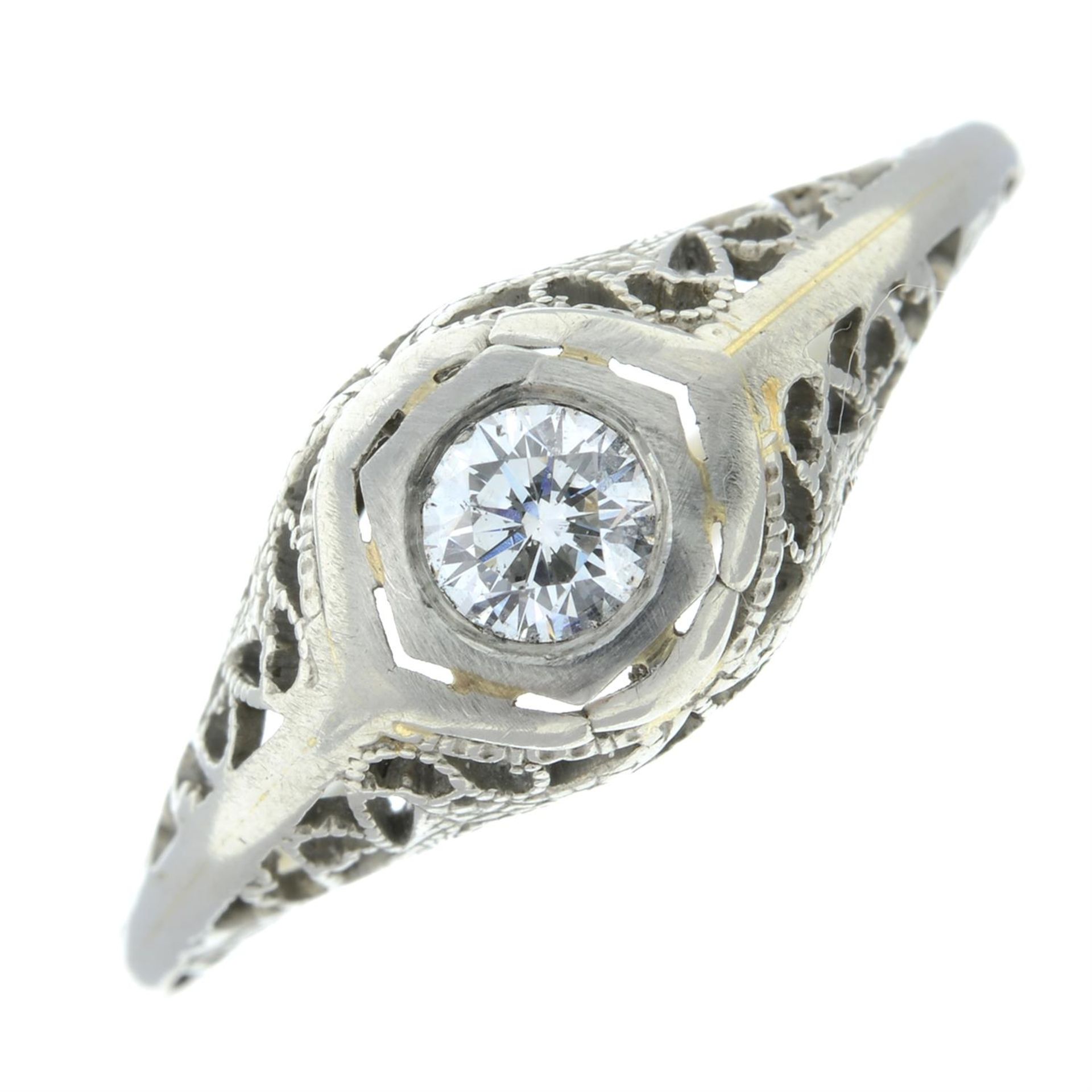 A brilliant-cut diamond single-stone ring, with openwork shoulders.