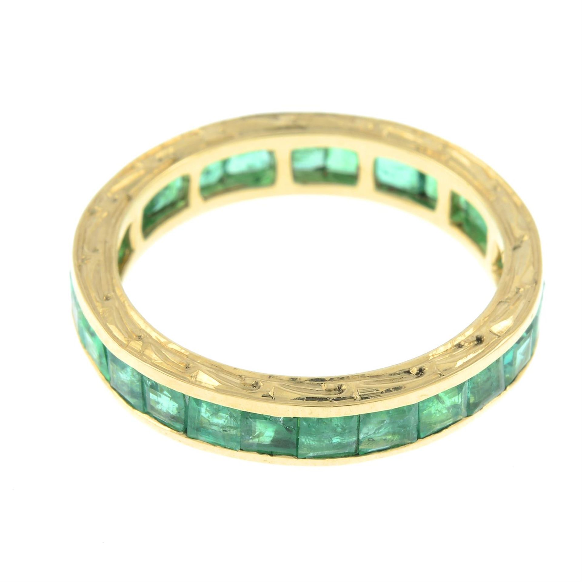 An emerald full eternity ring, with engraved sides. - Image 2 of 2