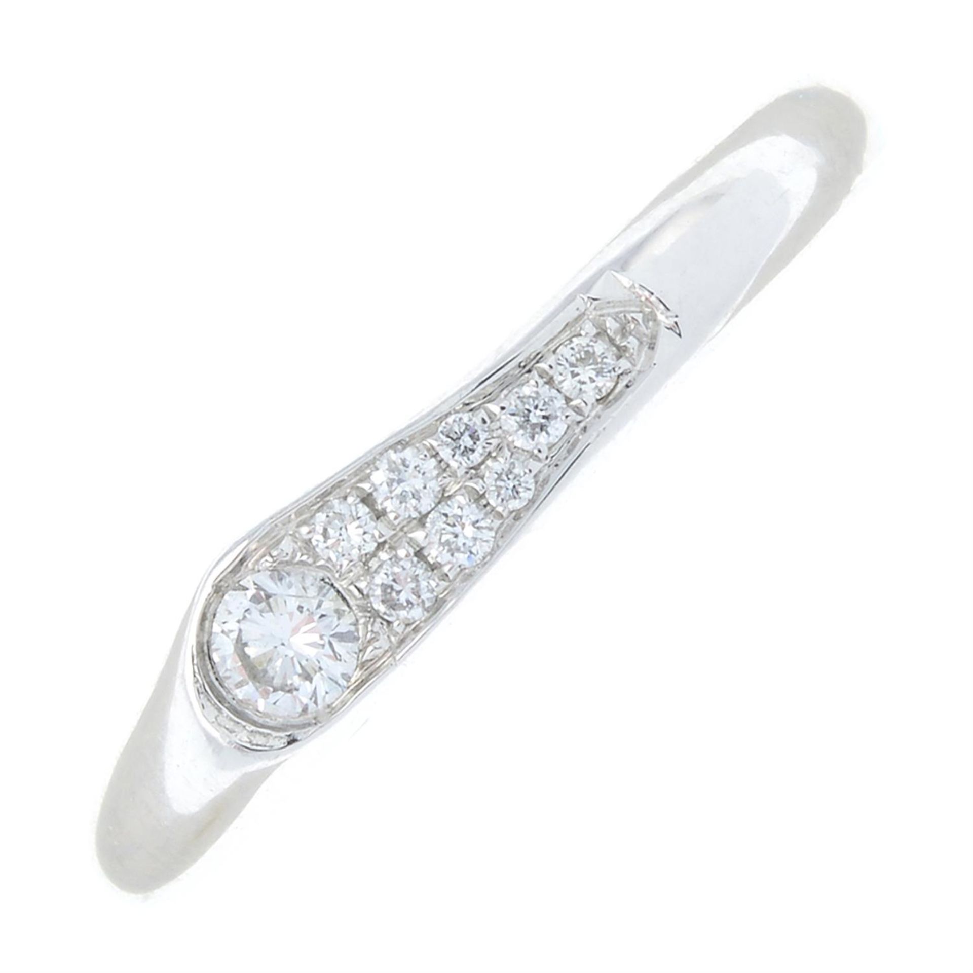 A platinum pavé-set diamond band ring.