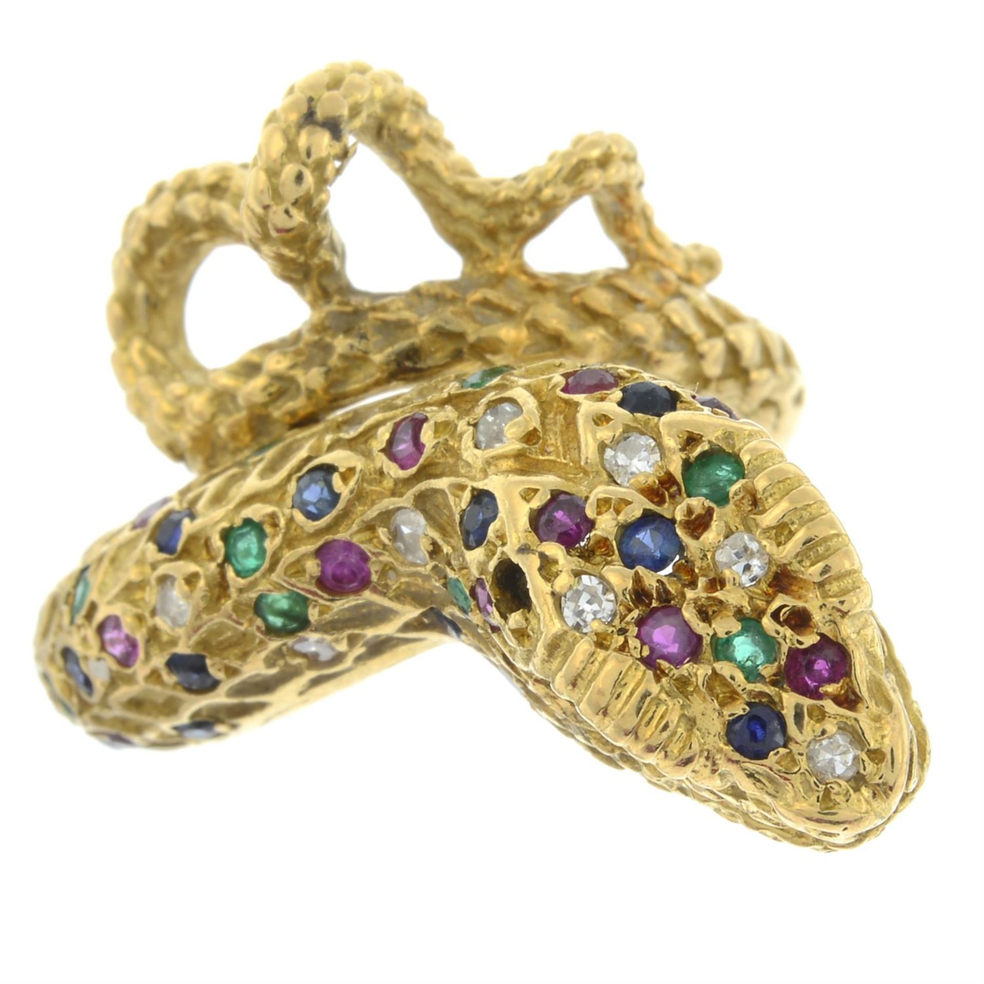 A sapphire, ruby, emerald and diamond snake ring.