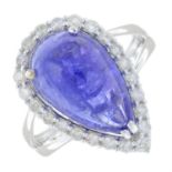 A tanzanite cabochon and diamond cluster ring.