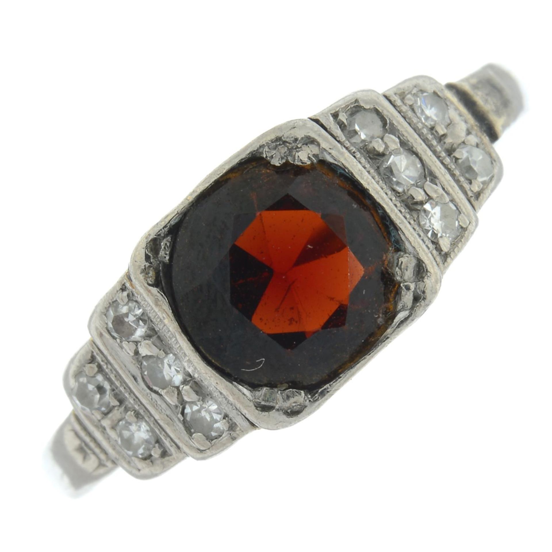 A garnet and single-cut diamond dress ring.