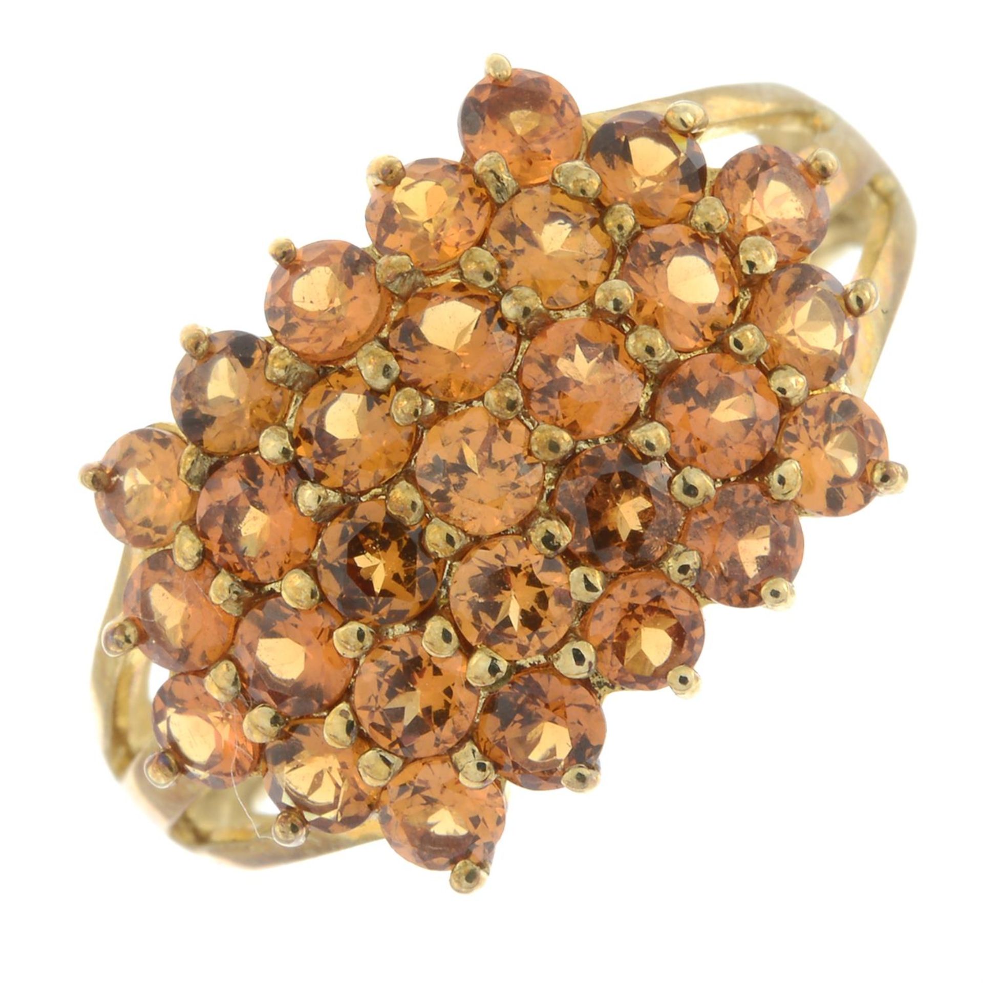 A 9ct gold orange garnet cluster ring.