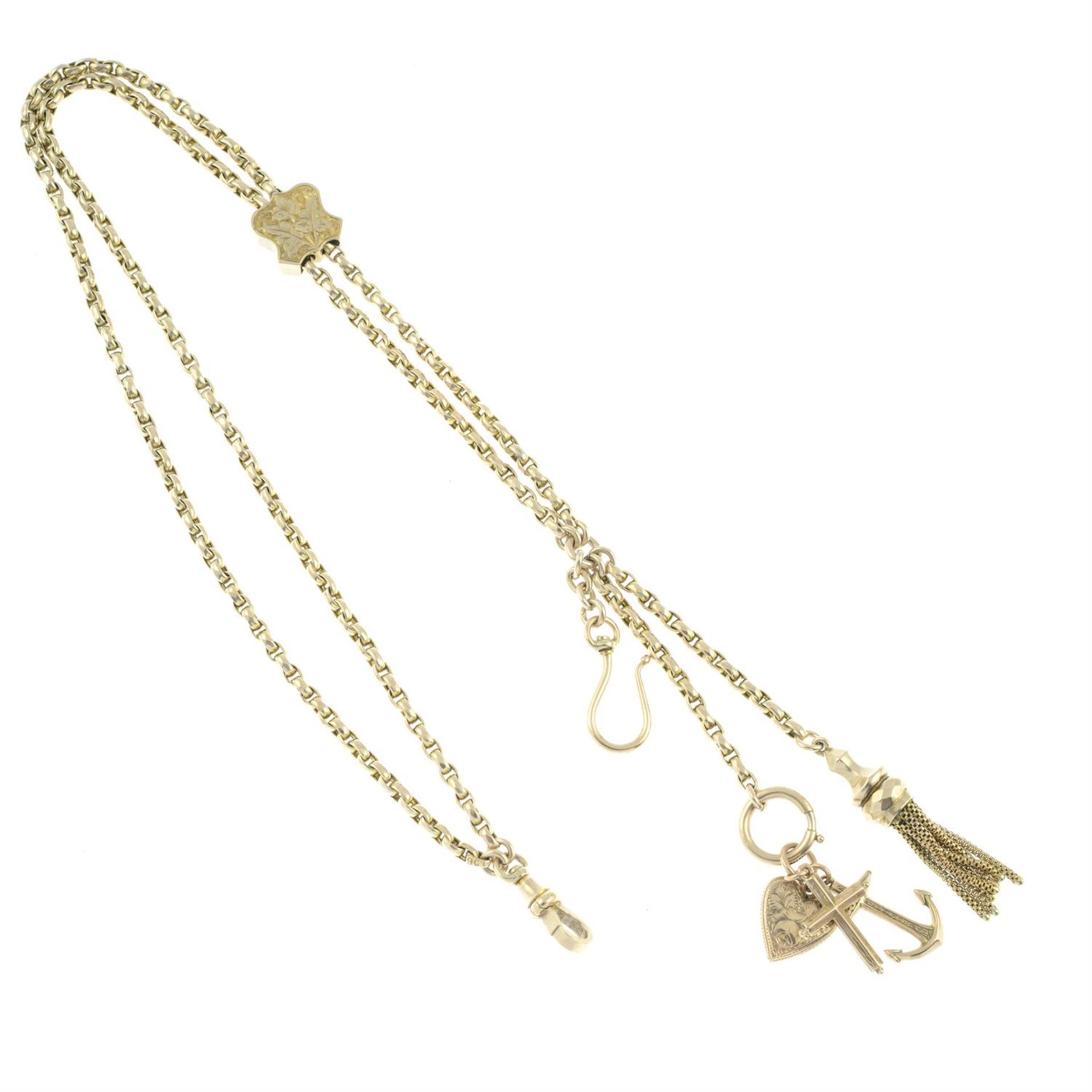 An early 20th century Albertina, suspending a tassel and three charms.