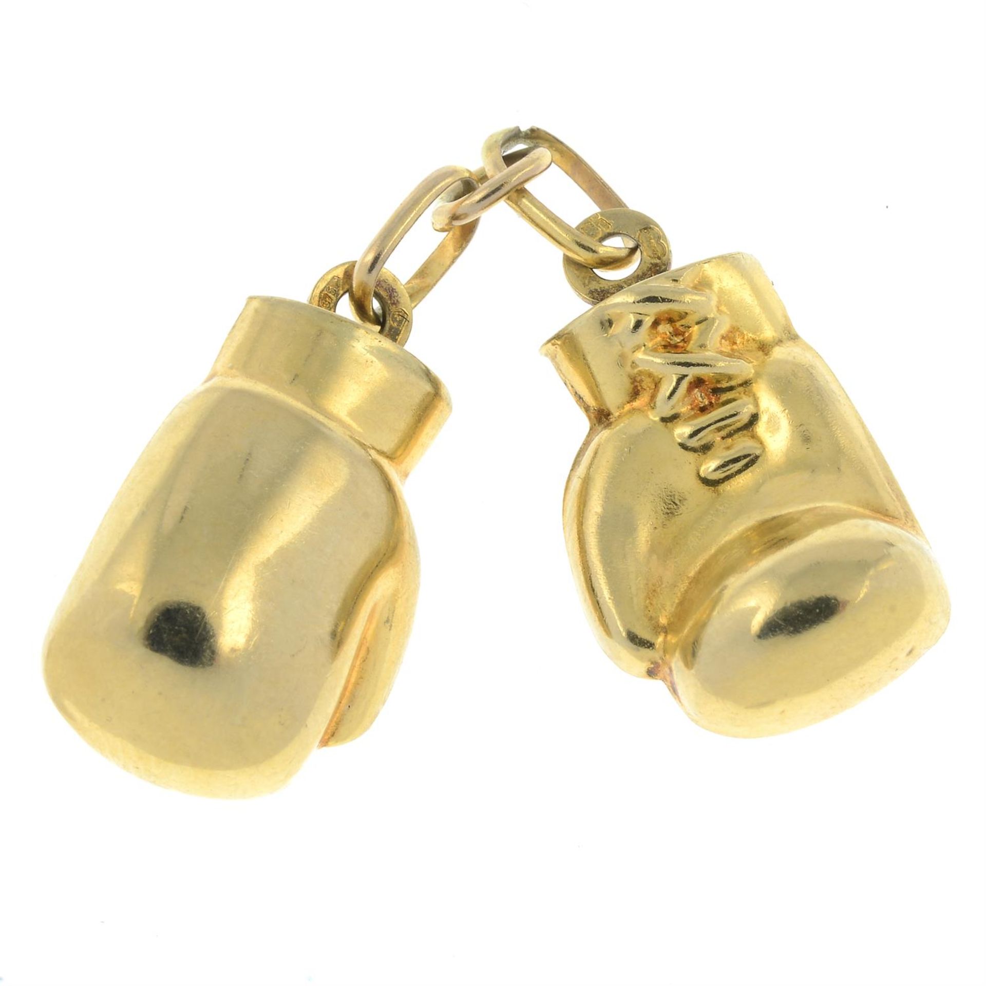 A pair of 9ct gold boxing gloves.