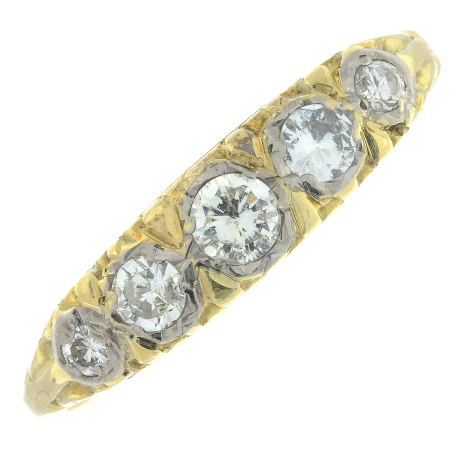 A brilliant-cut diamond five-stone ring.