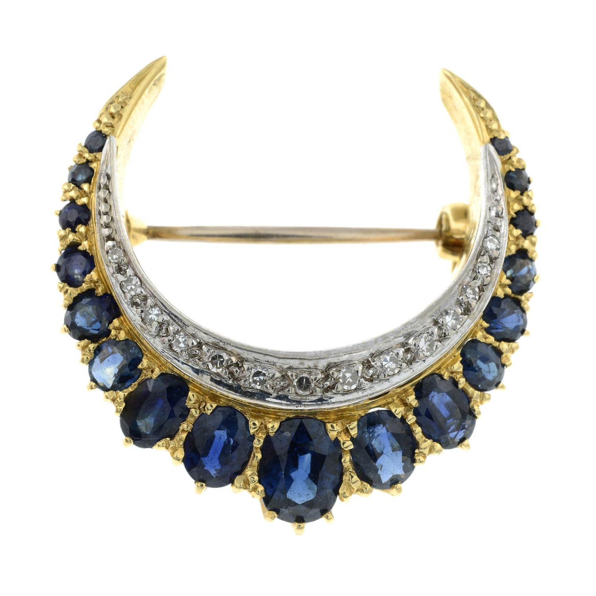 A sapphire and single-cut diamond crescent brooch.