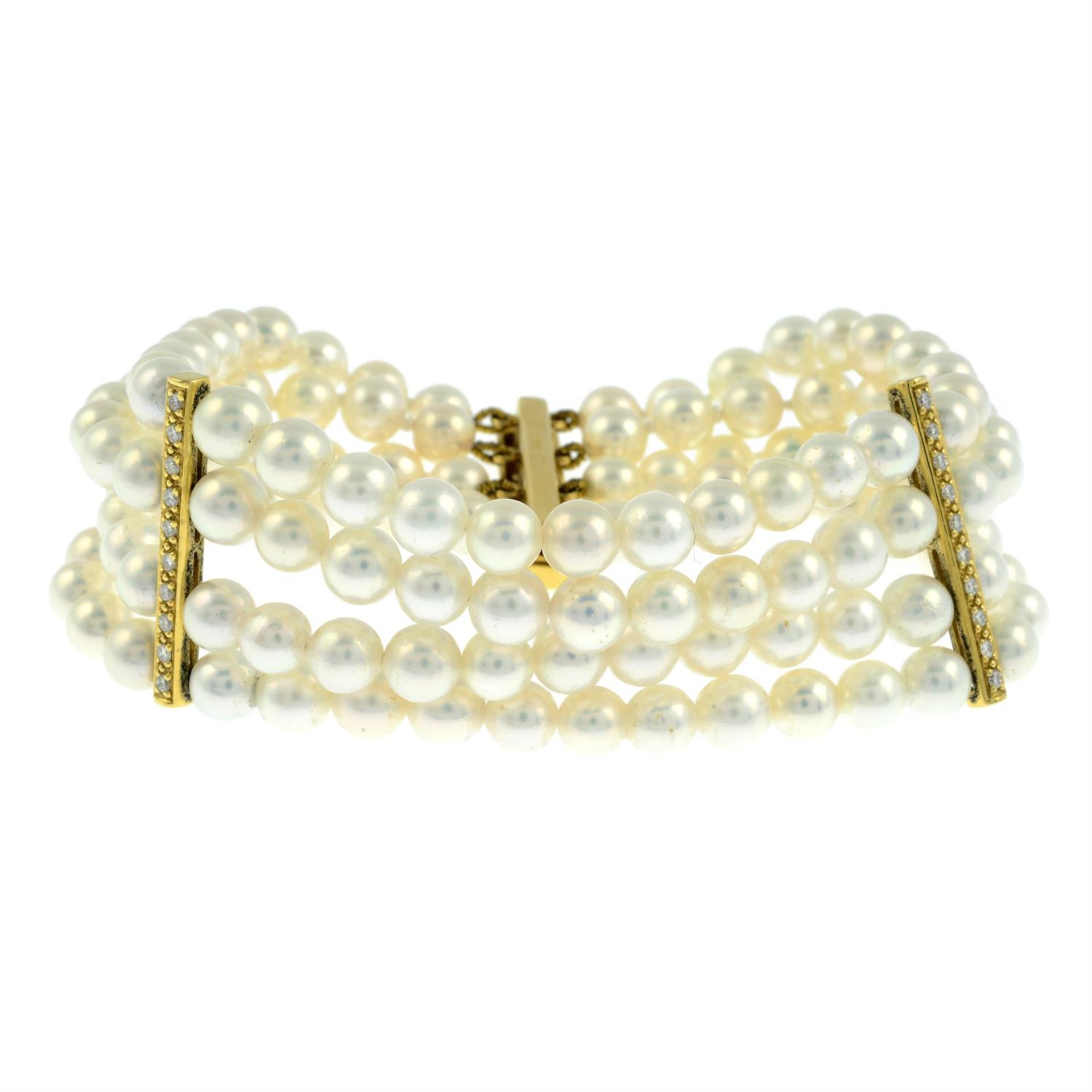 An 18ct gold four-row cultured pearl bracelet, with diamond spacers.