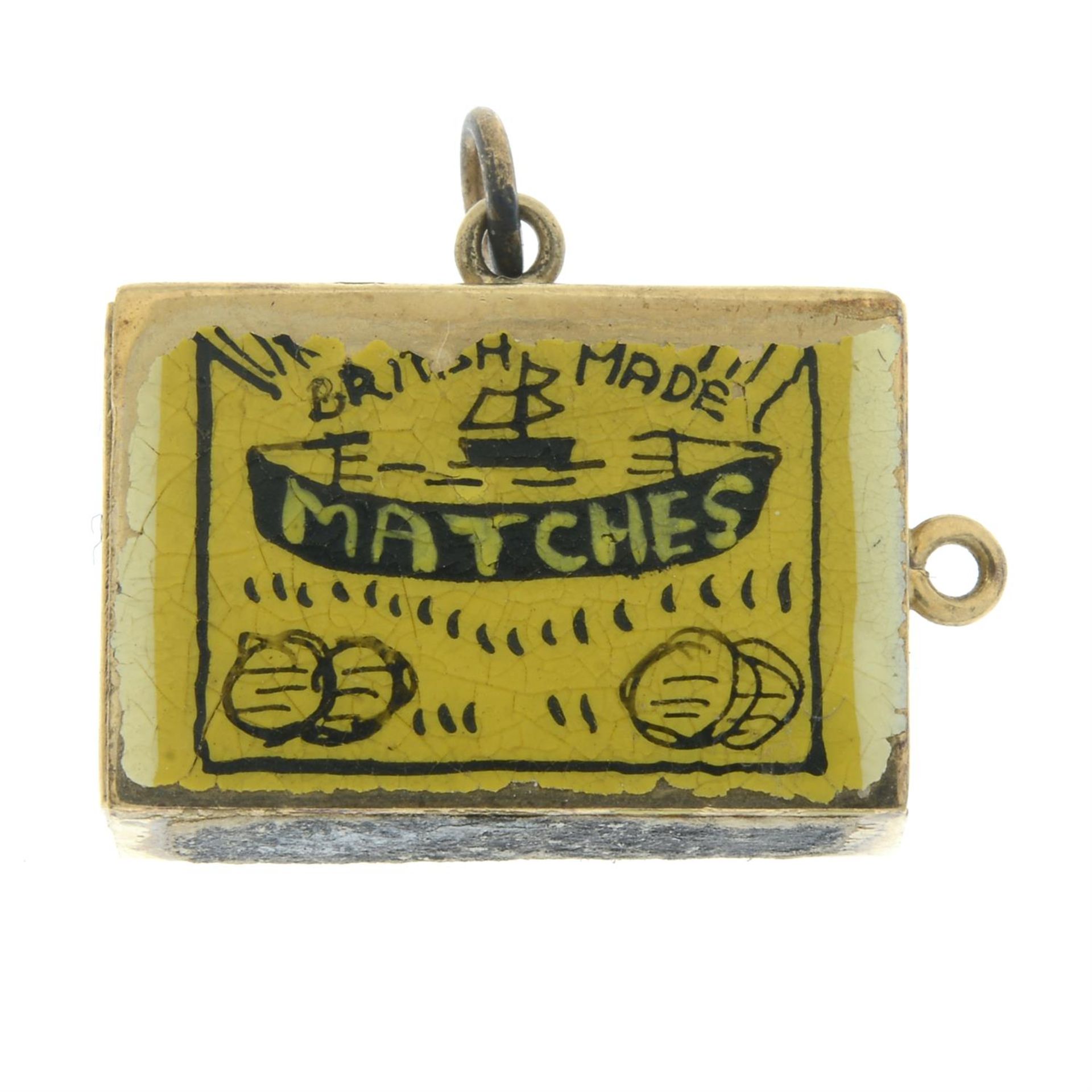 A 9ct gold miniature match box charm, with enamel detail.