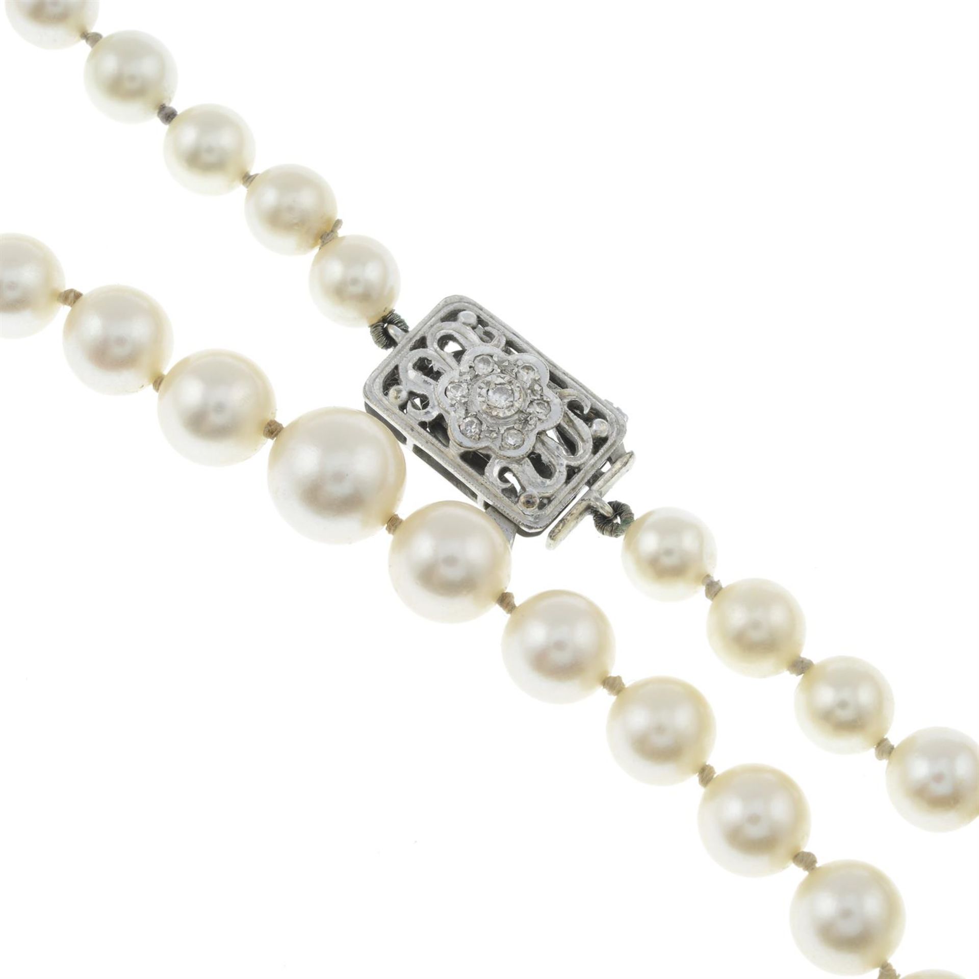 A slightly graduated cultured pearl single-strand necklace, with 9ct gold diamond floral clasp. - Image 2 of 3