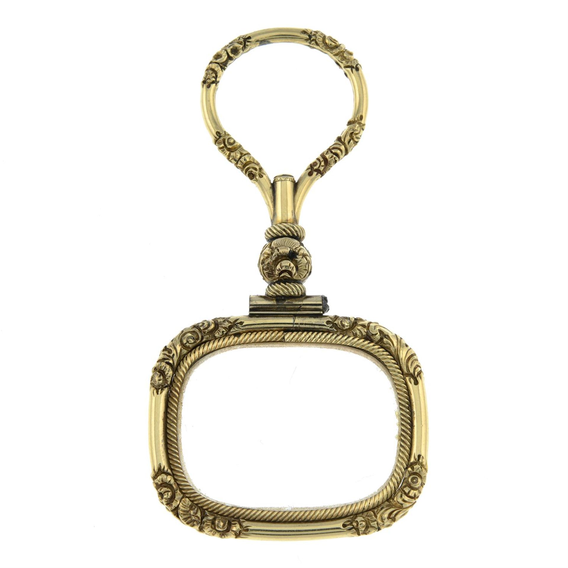 A late 19th century gold magnifying glass.
