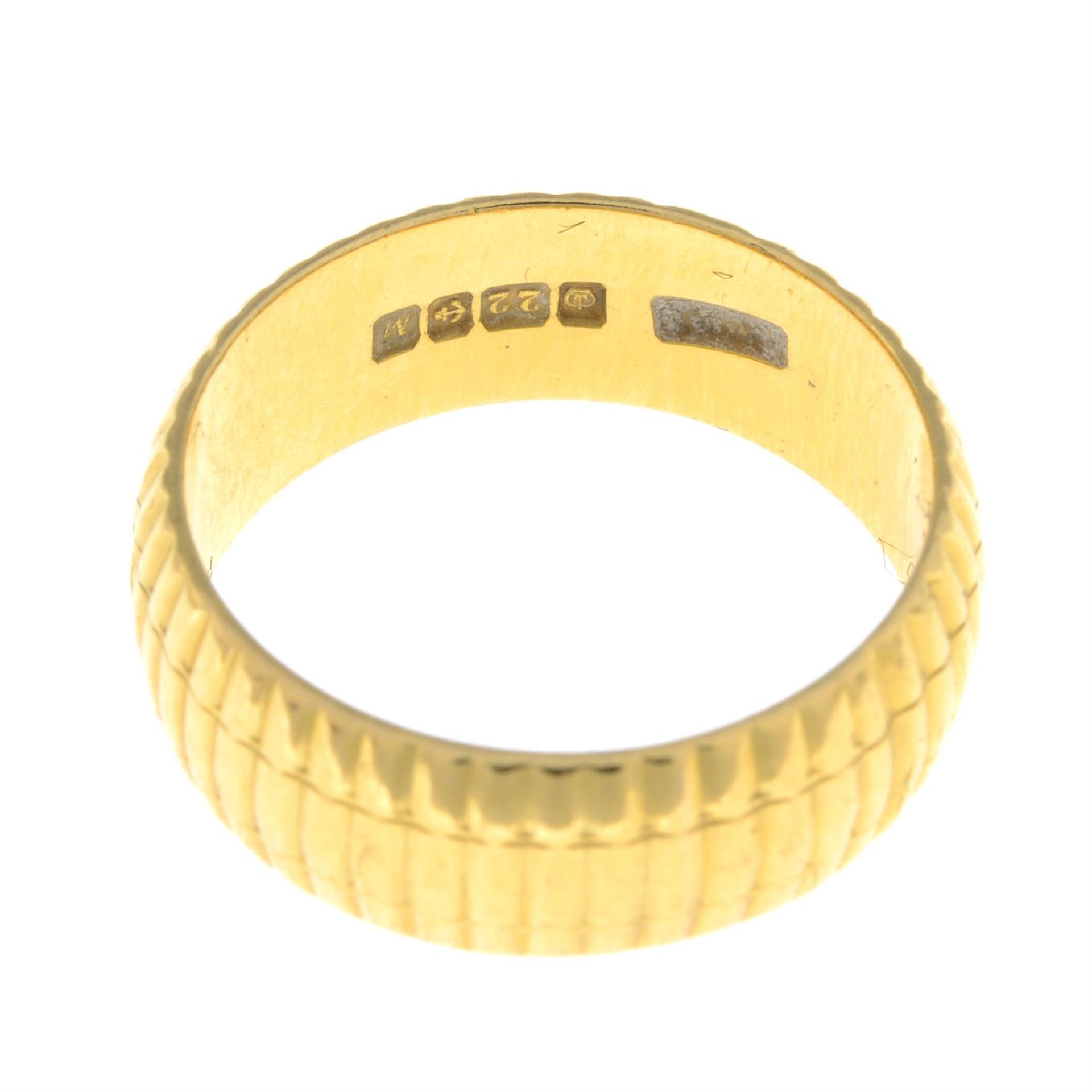 A 22ct gold textured band ring. - Image 2 of 2