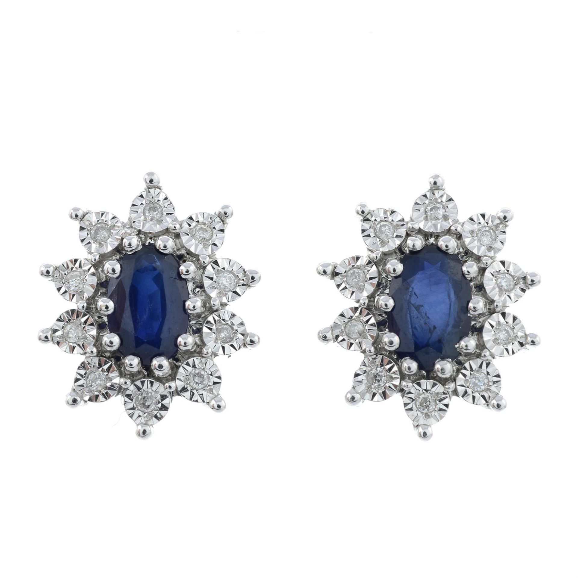 A pair of 9ct gold sapphire and diamond cluster earrings.