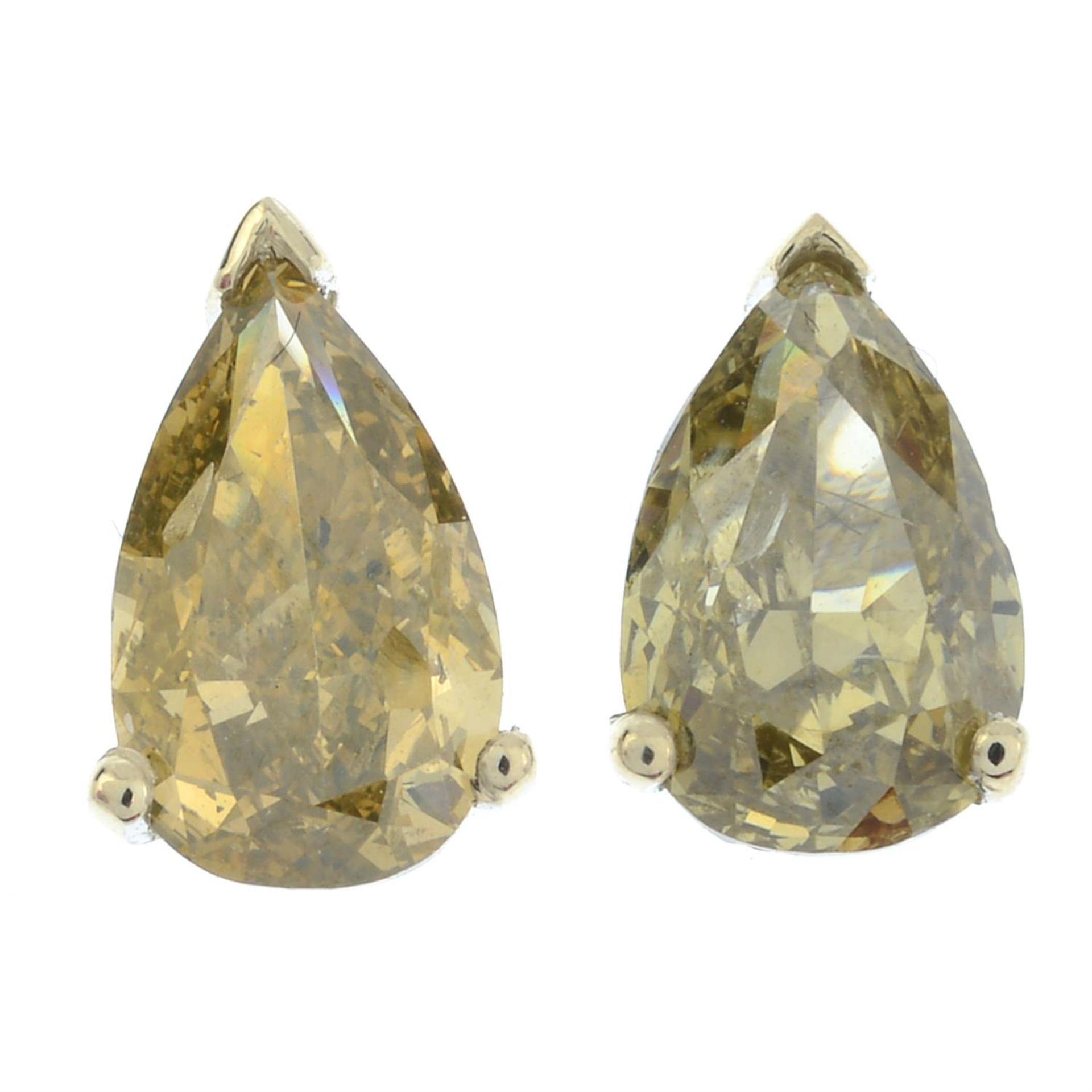 A pair of 18ct gold pear-shape Fancy Dark Greenish Yellow diamond stud earrings.