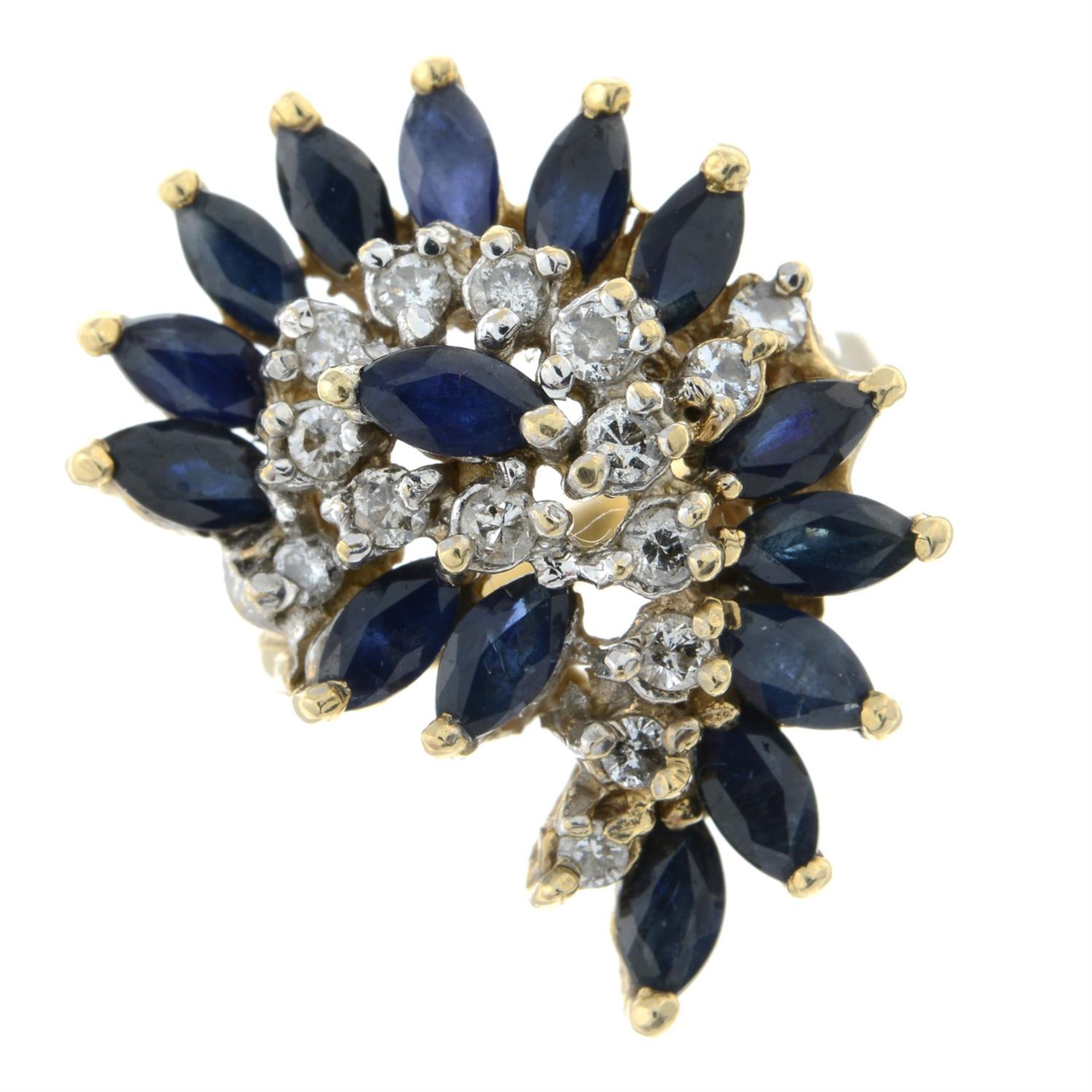 A marquise-shaped sapphire and brilliant-cut diamond dress ring.