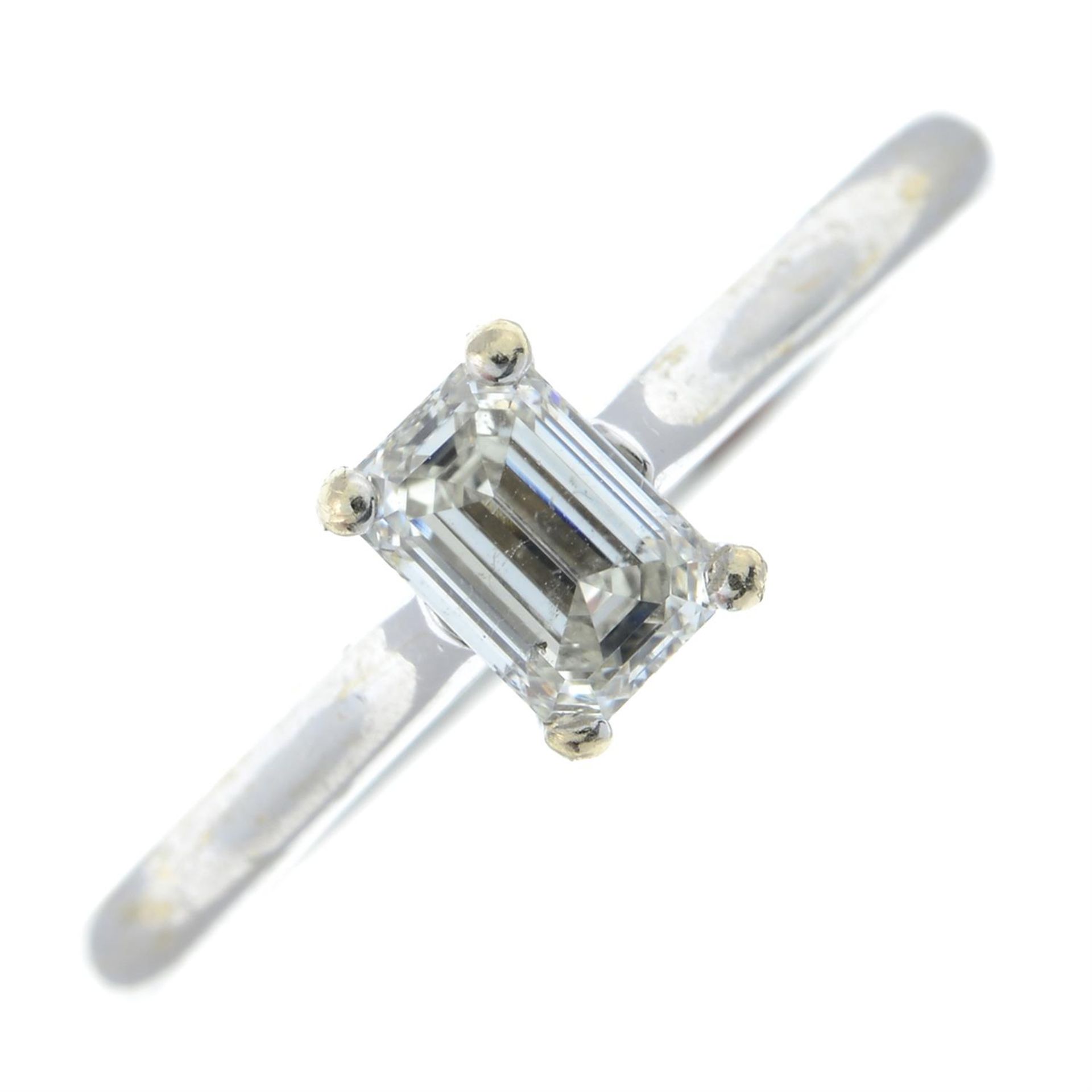 An 18ct gold rectangular-shape diamond single-stone ring.