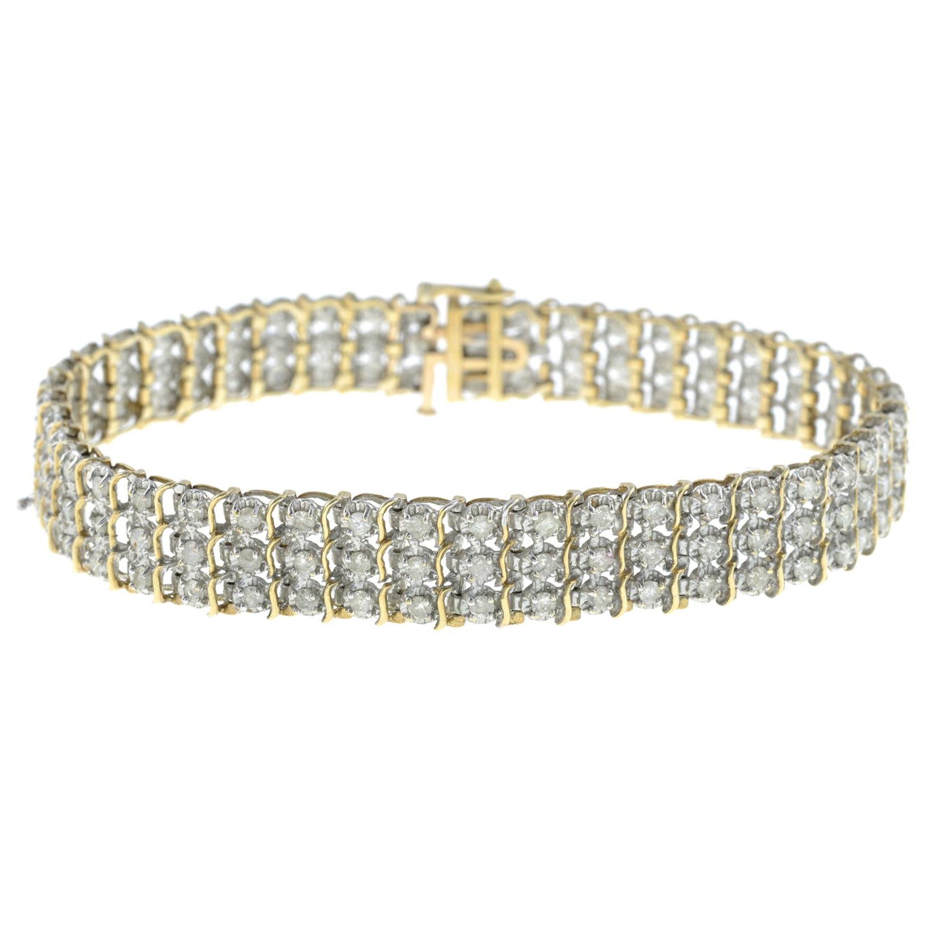 A 9ct gold diamond bracelet.