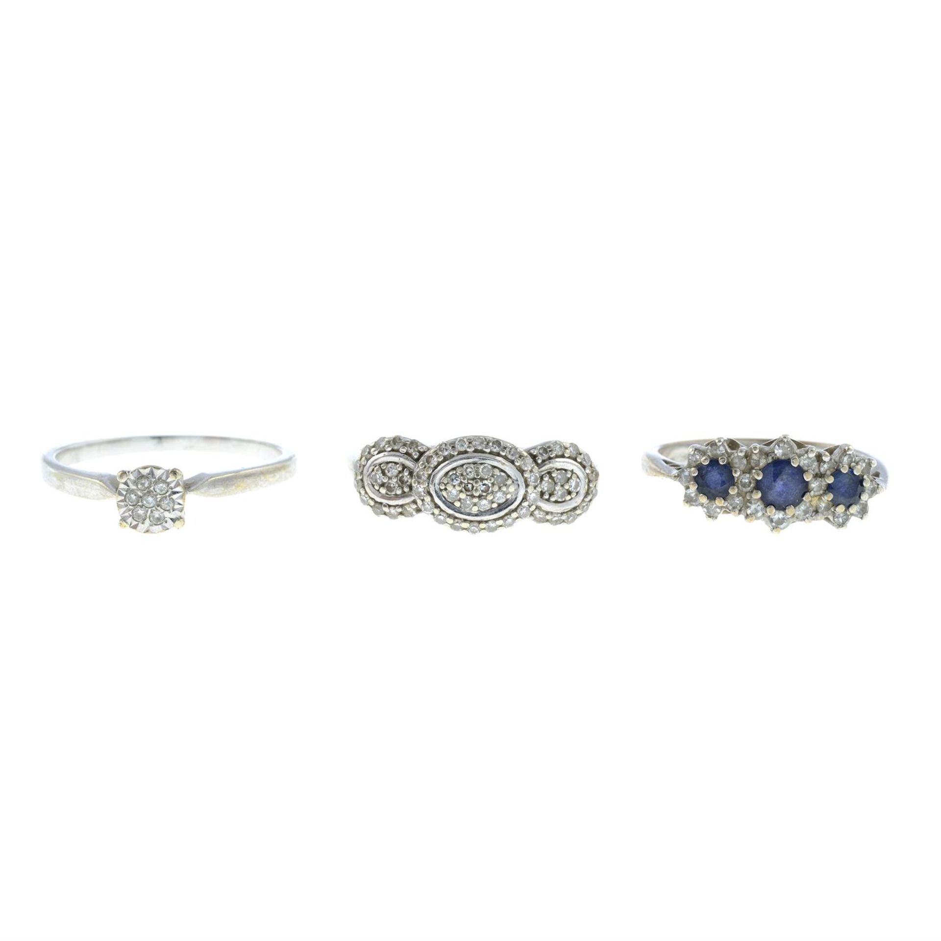 Two 9ct gold gem-set rings, together with a similar ring.