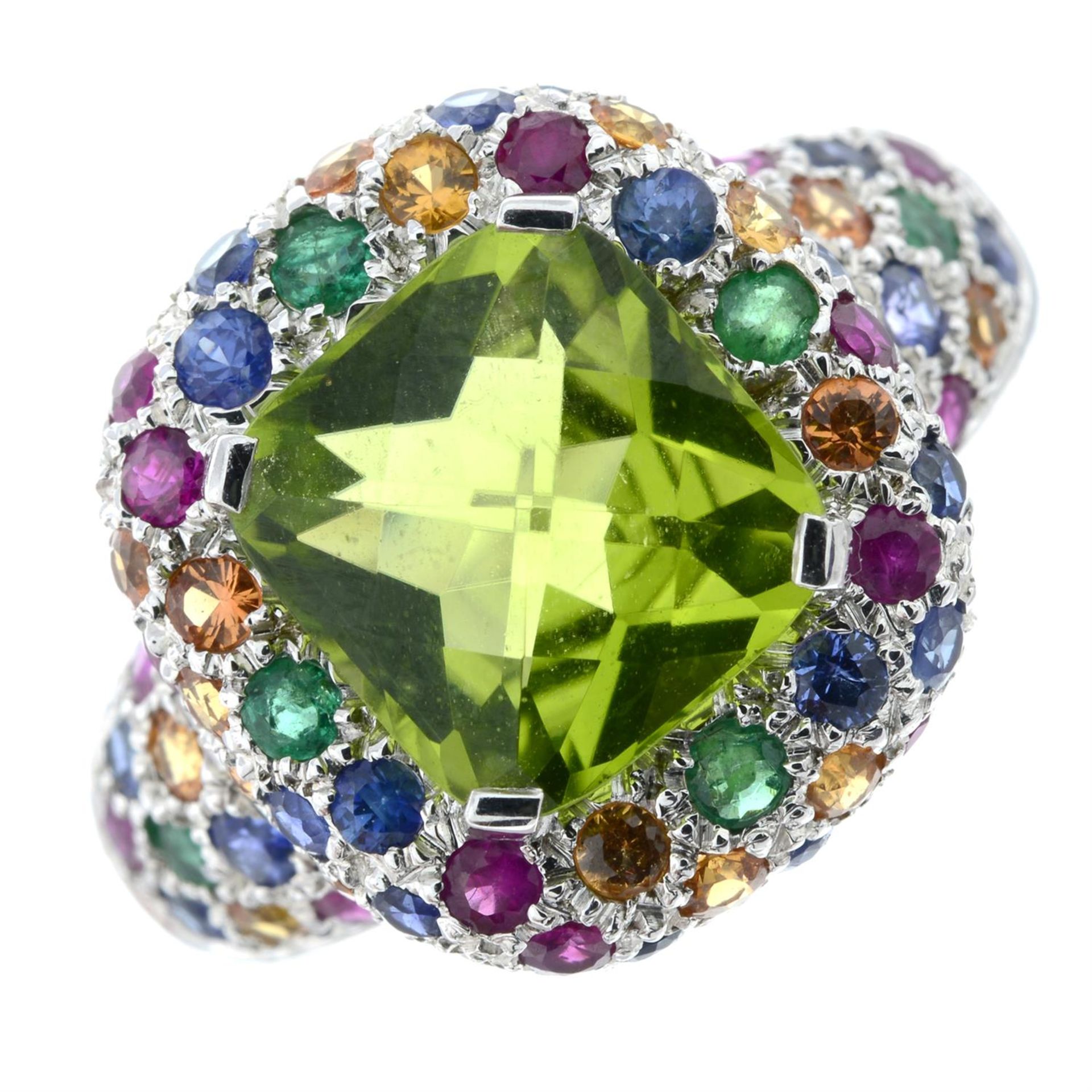 A peridot dress ring, with emerald, ruby, sapphire and topaz accents.