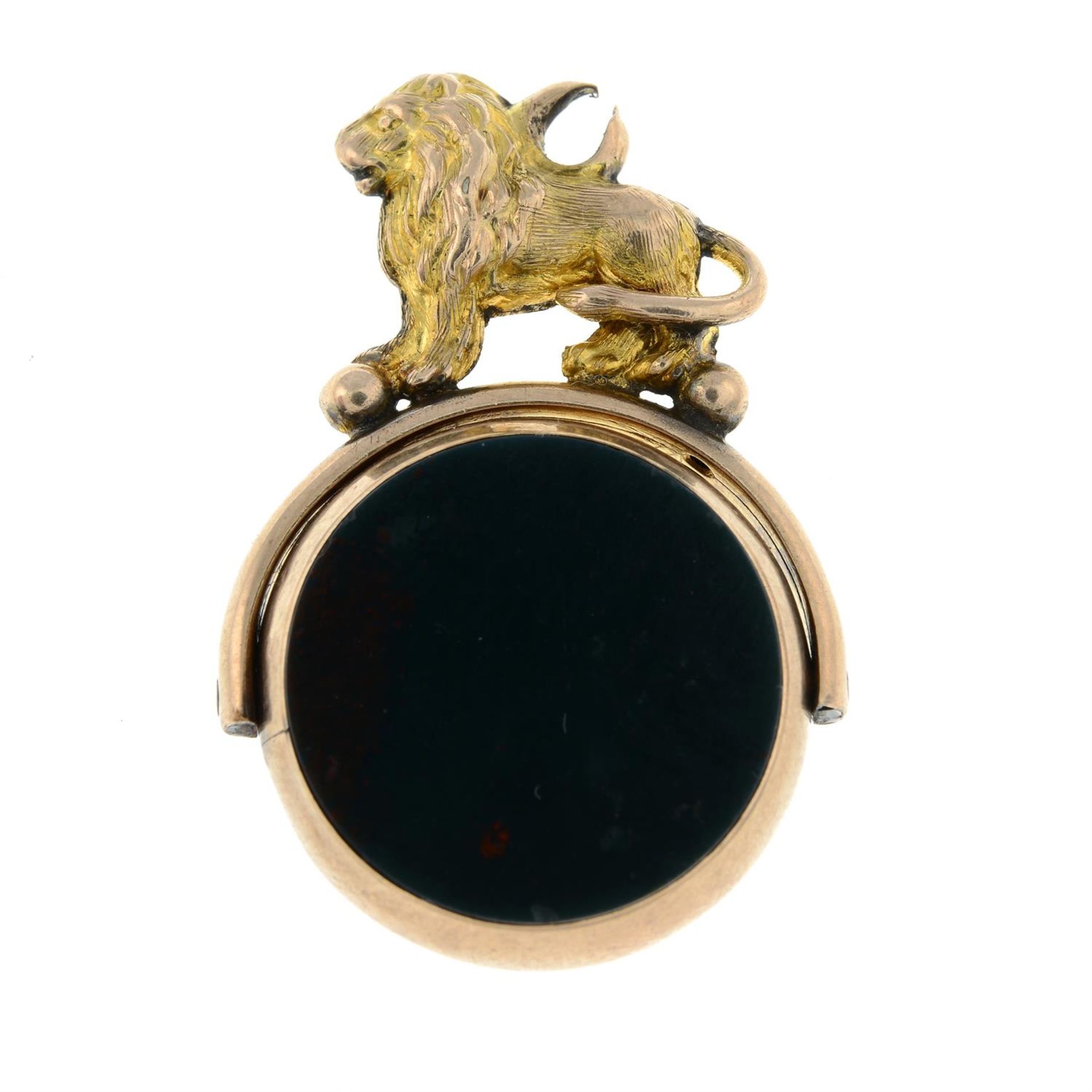 A late Victorian 9ct gold carnelian and bloodstone swivel fob, with lion mount.