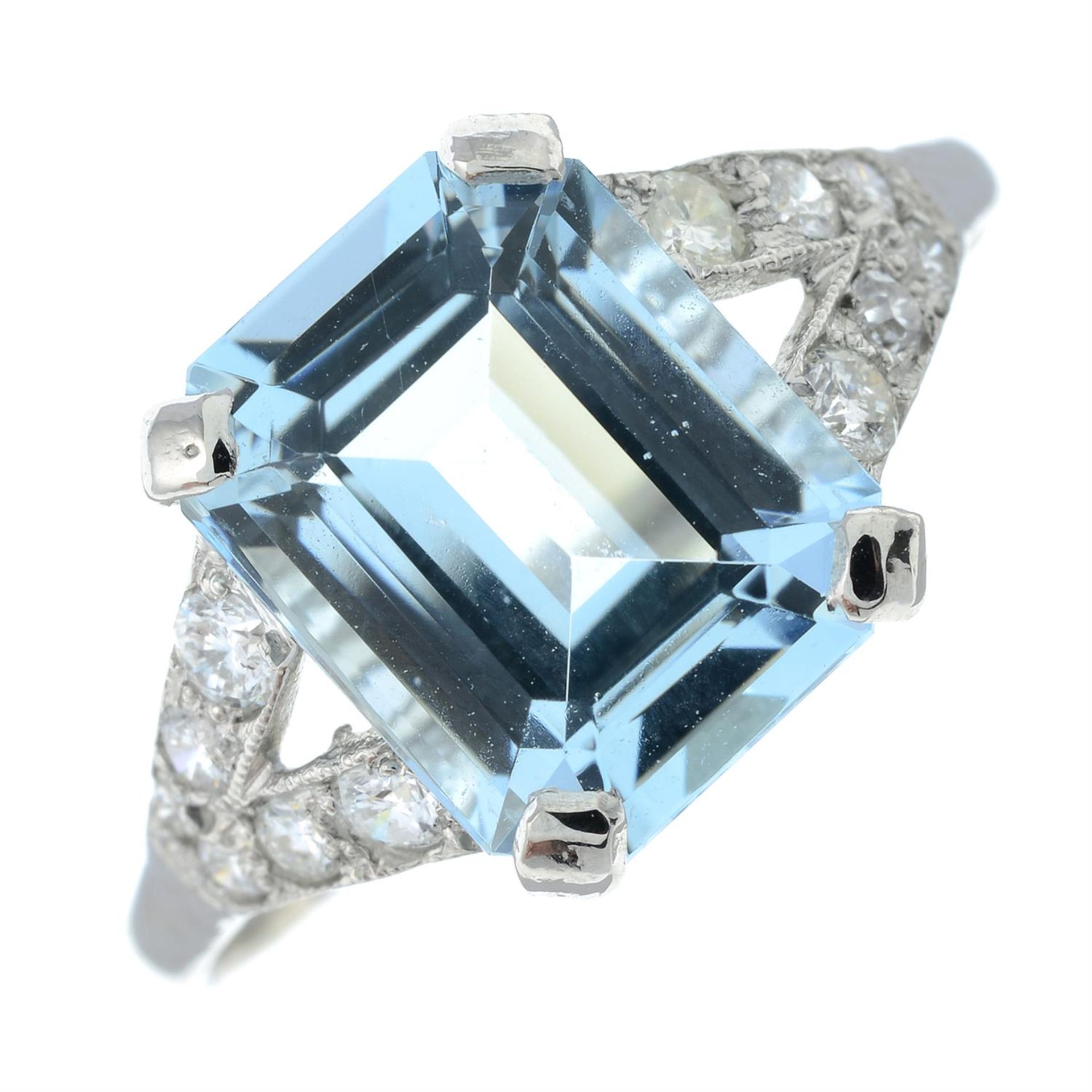 An aquamarine and diamond ring.