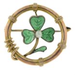 An early 20th century 15ct gold enamel and seed pearl shamrock brooch.