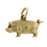 A late 19th century 18ct gold pig charm/ pendant, with ruby cabochon eyes.