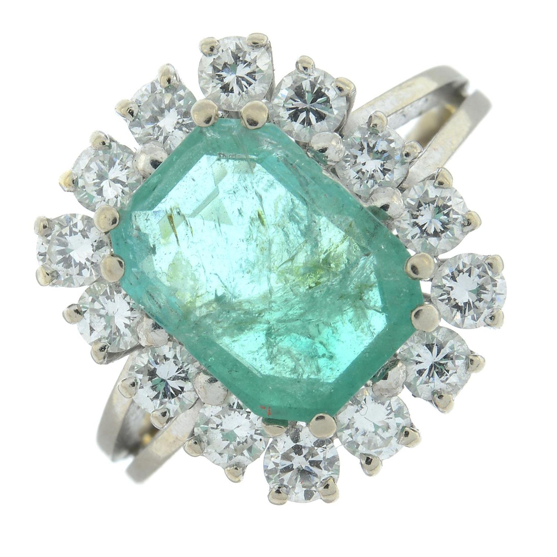 A brilliant-cut diamond and emerald cluster ring.