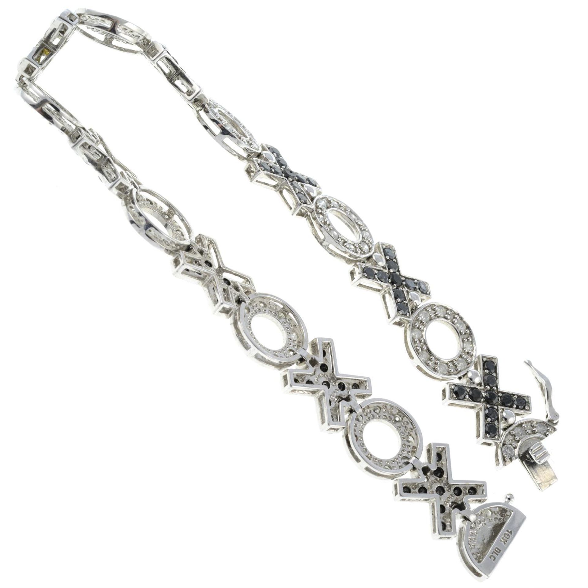 A diamond and black gem fancy-link bracelet. - Image 2 of 2