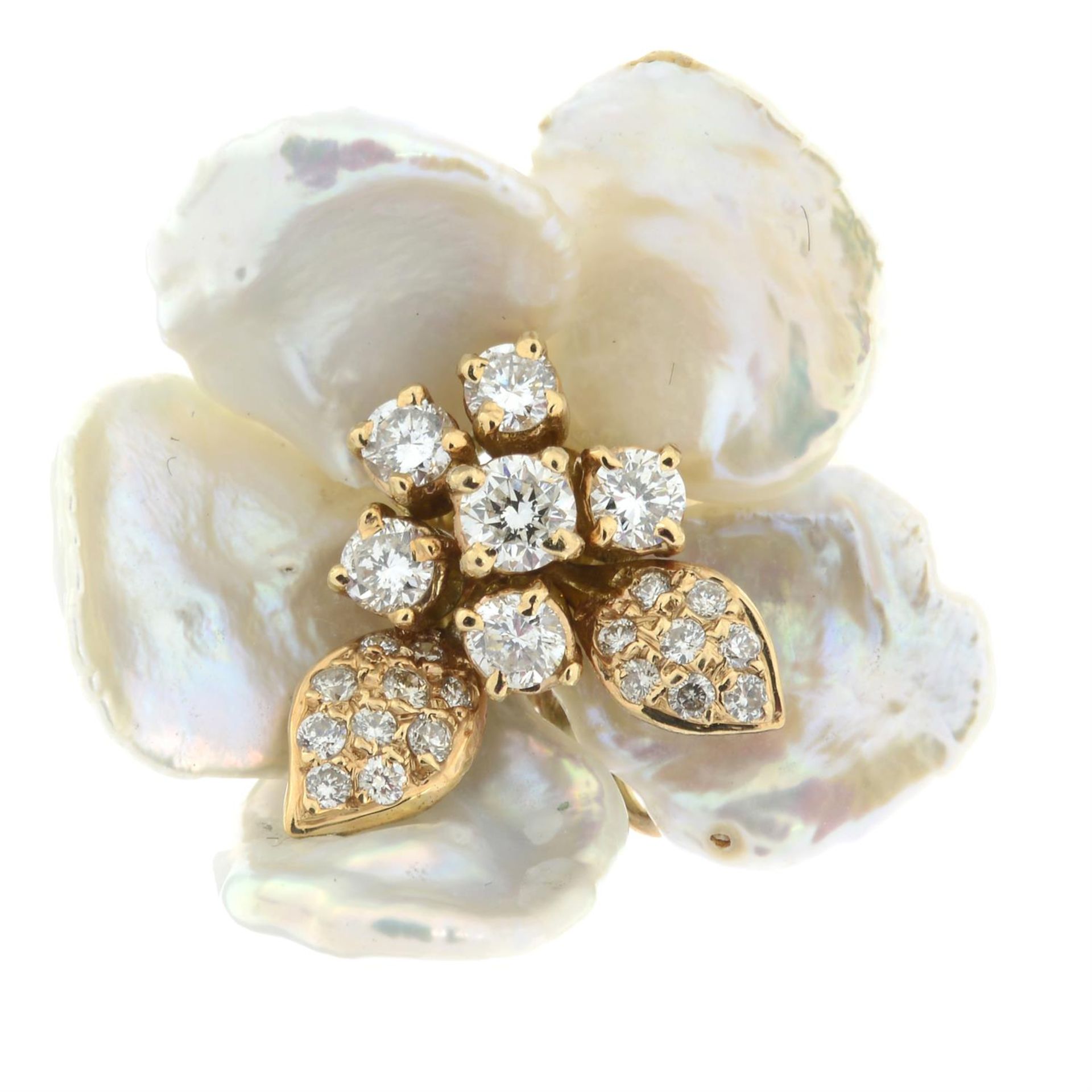 A mother-of-pearl and diamond floral dress ring.