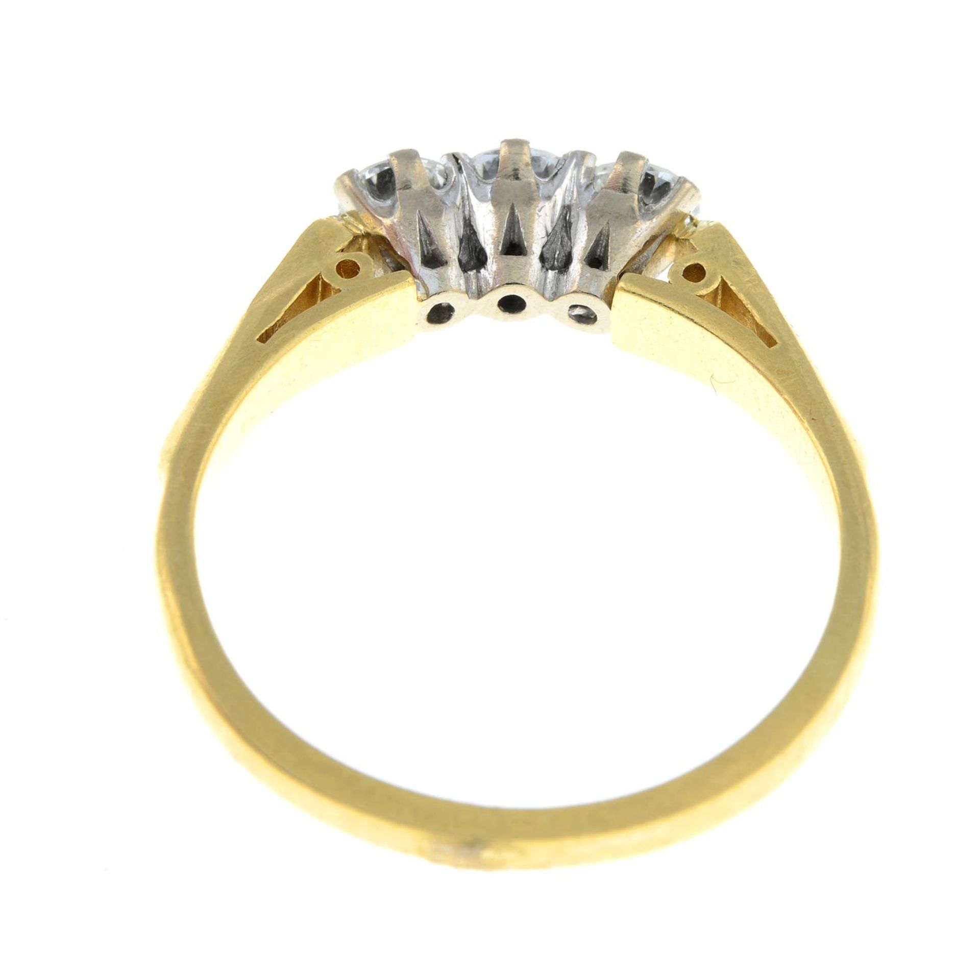 An 18ct gold brilliant-cut diamond three-stone ring, with single-cut diamond sides. - Image 2 of 2