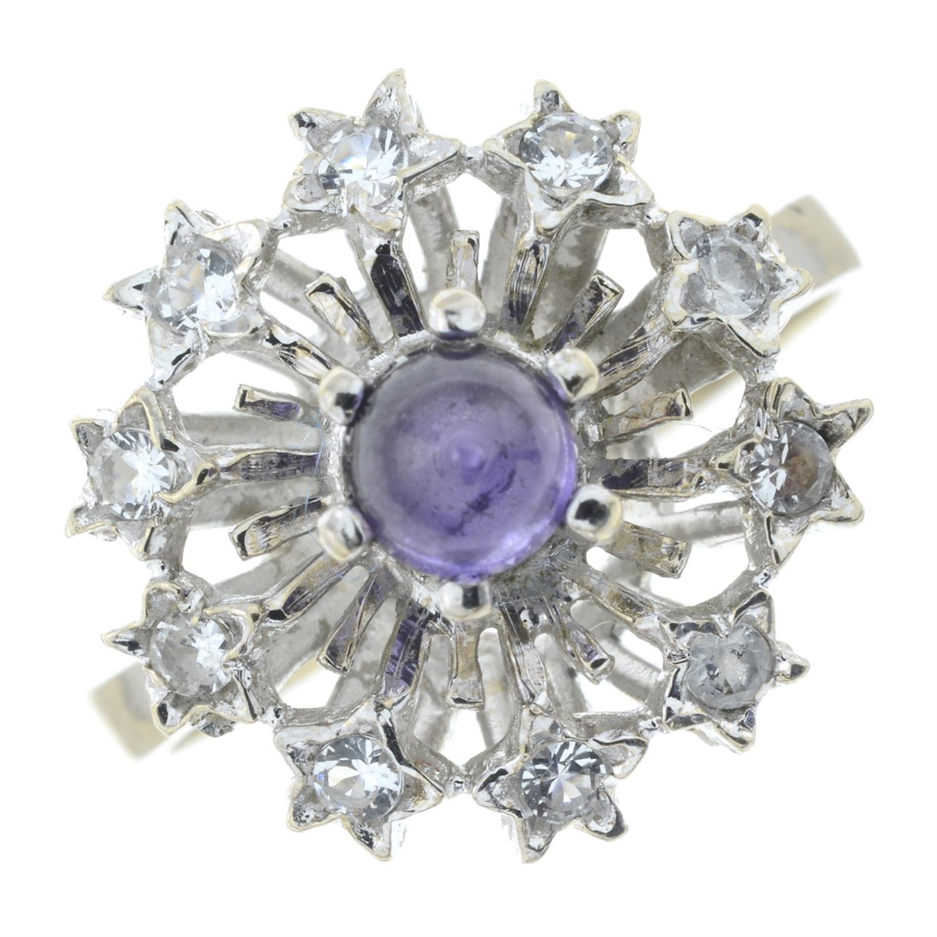 A purple sapphire and colourless gem cluster ring.