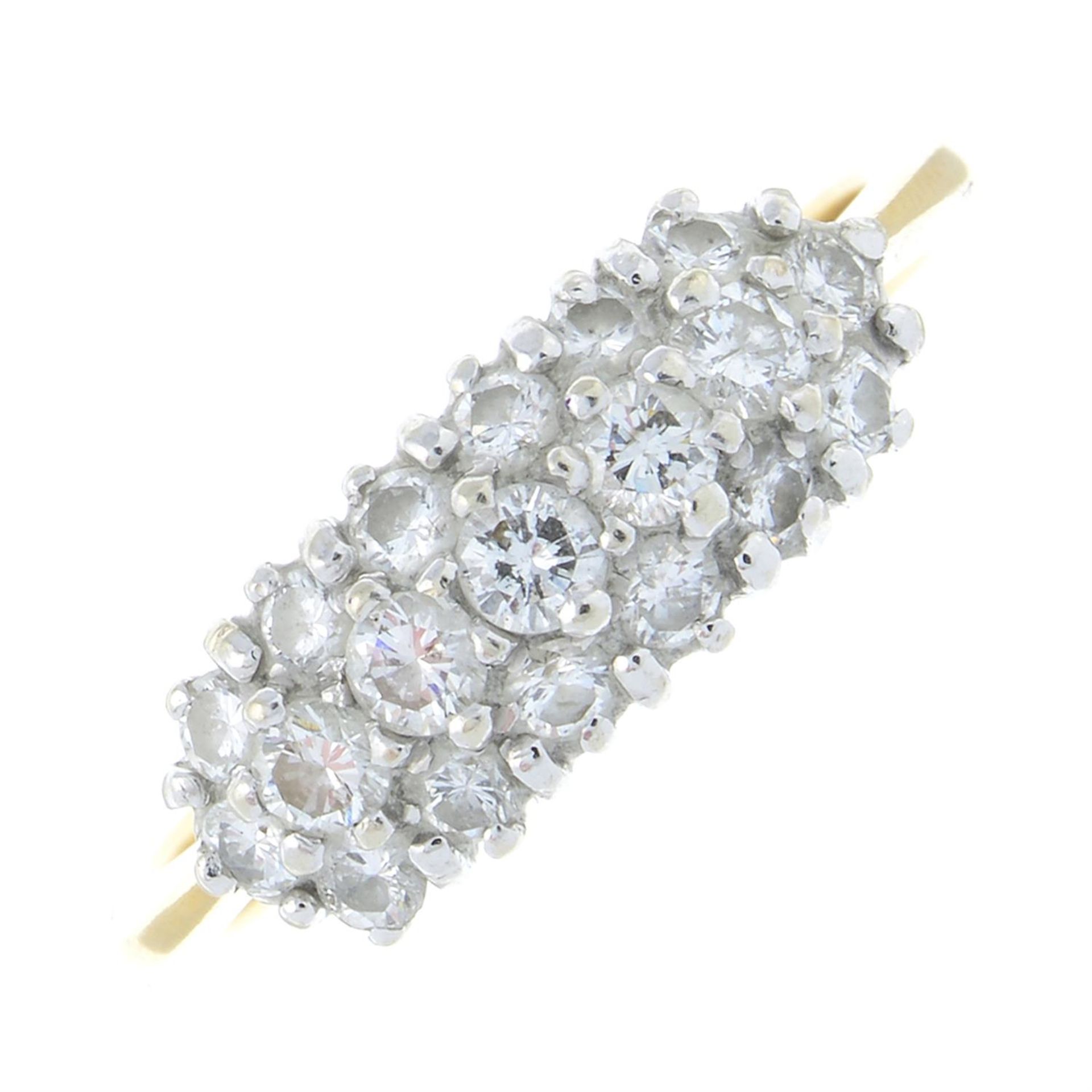 An 18ct gold brilliant-cut diamond three row cluster ring.