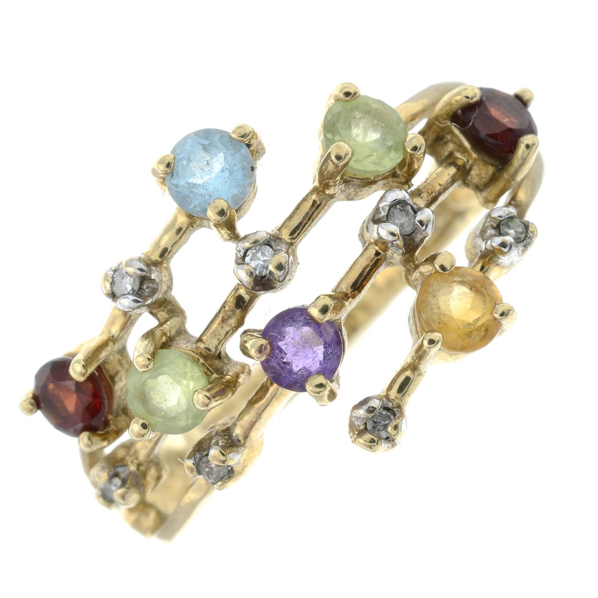 A 9ct gold diamond and multi-gem set openwork ring.