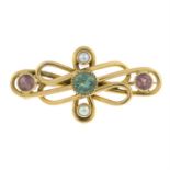 An early 20th century gold tourmaline and split pearl brooch.
