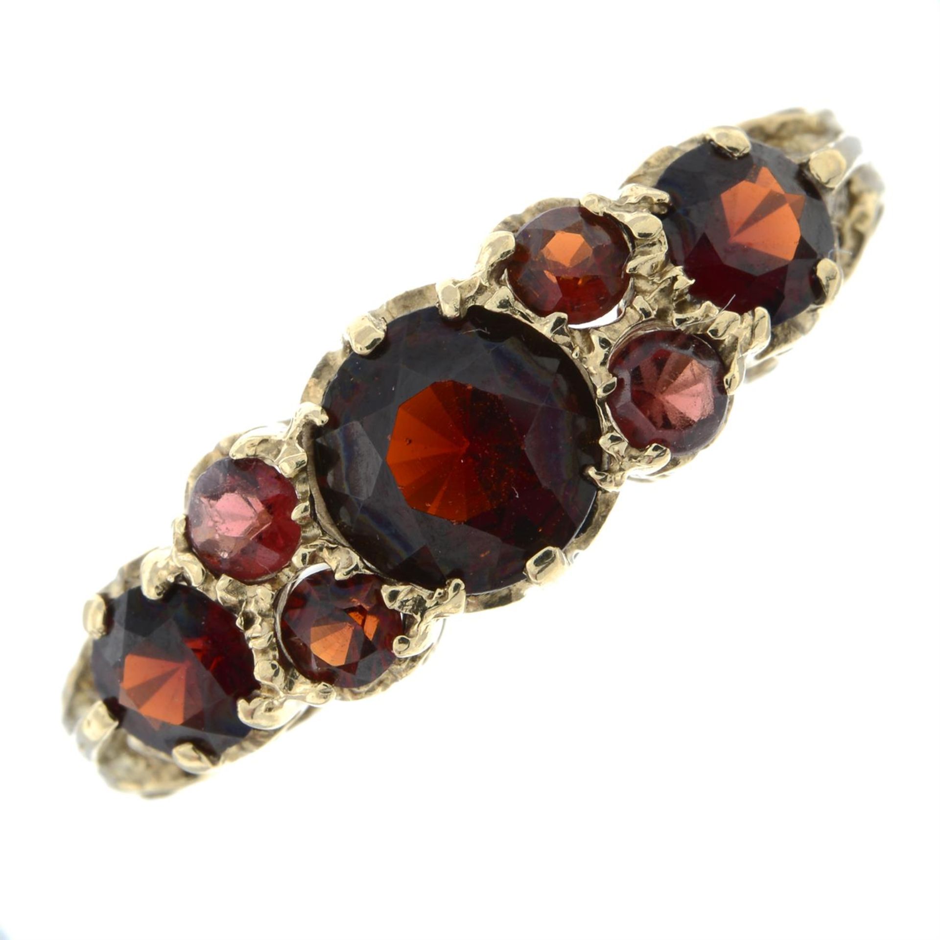 A garnet dress ring.