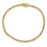 An 18ct gold diamond line bracelet.