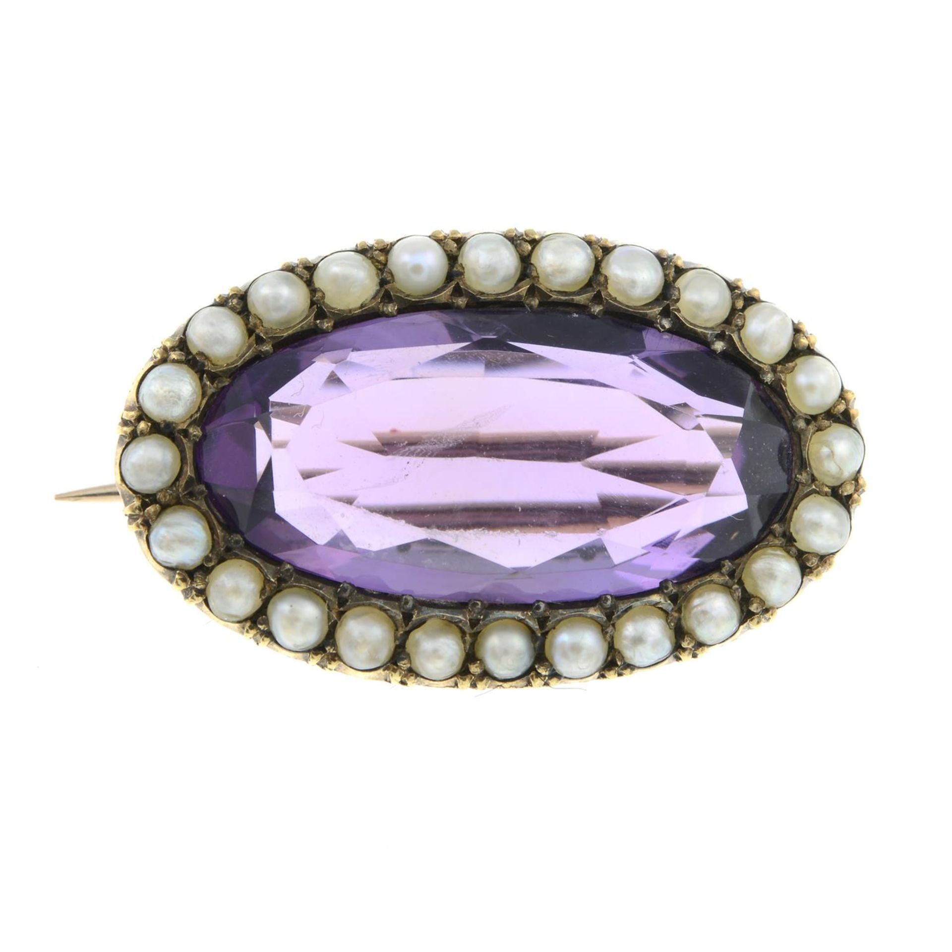 A 19th century amethyst and split pearl brooch.