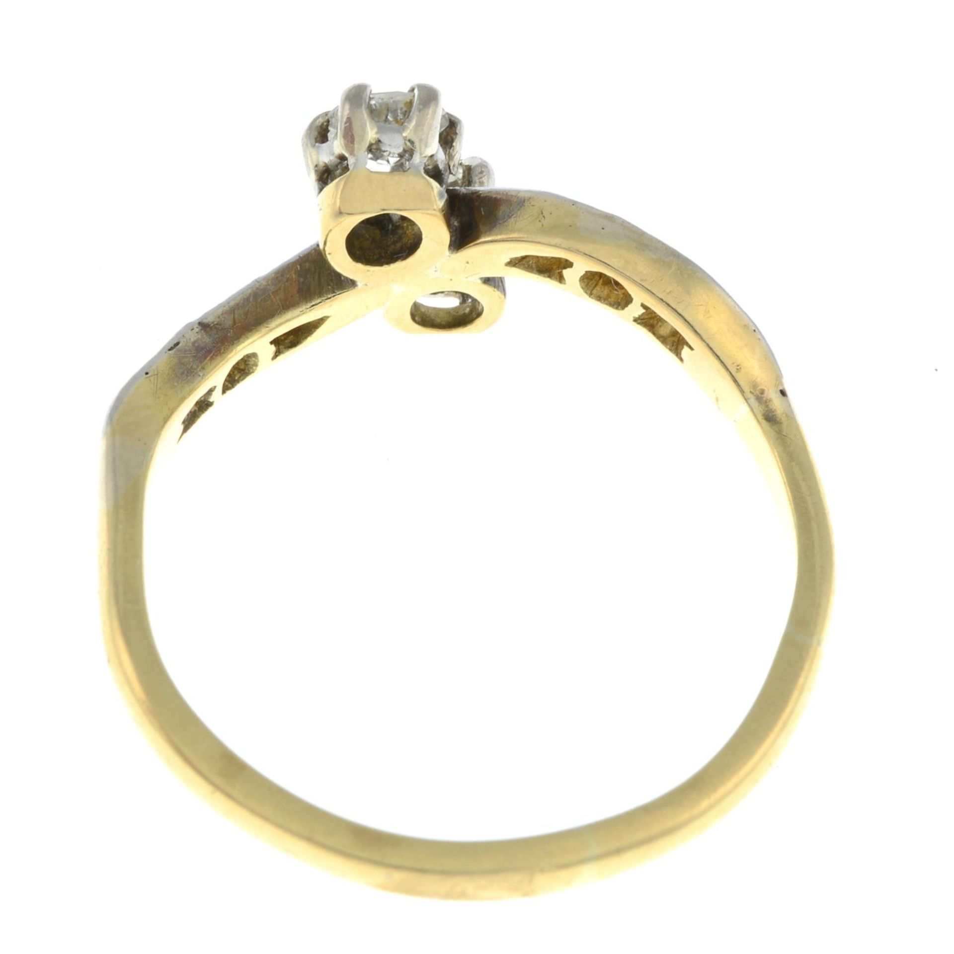 A diamond two-stone crossover ring, with diamond shoulders. - Image 2 of 2