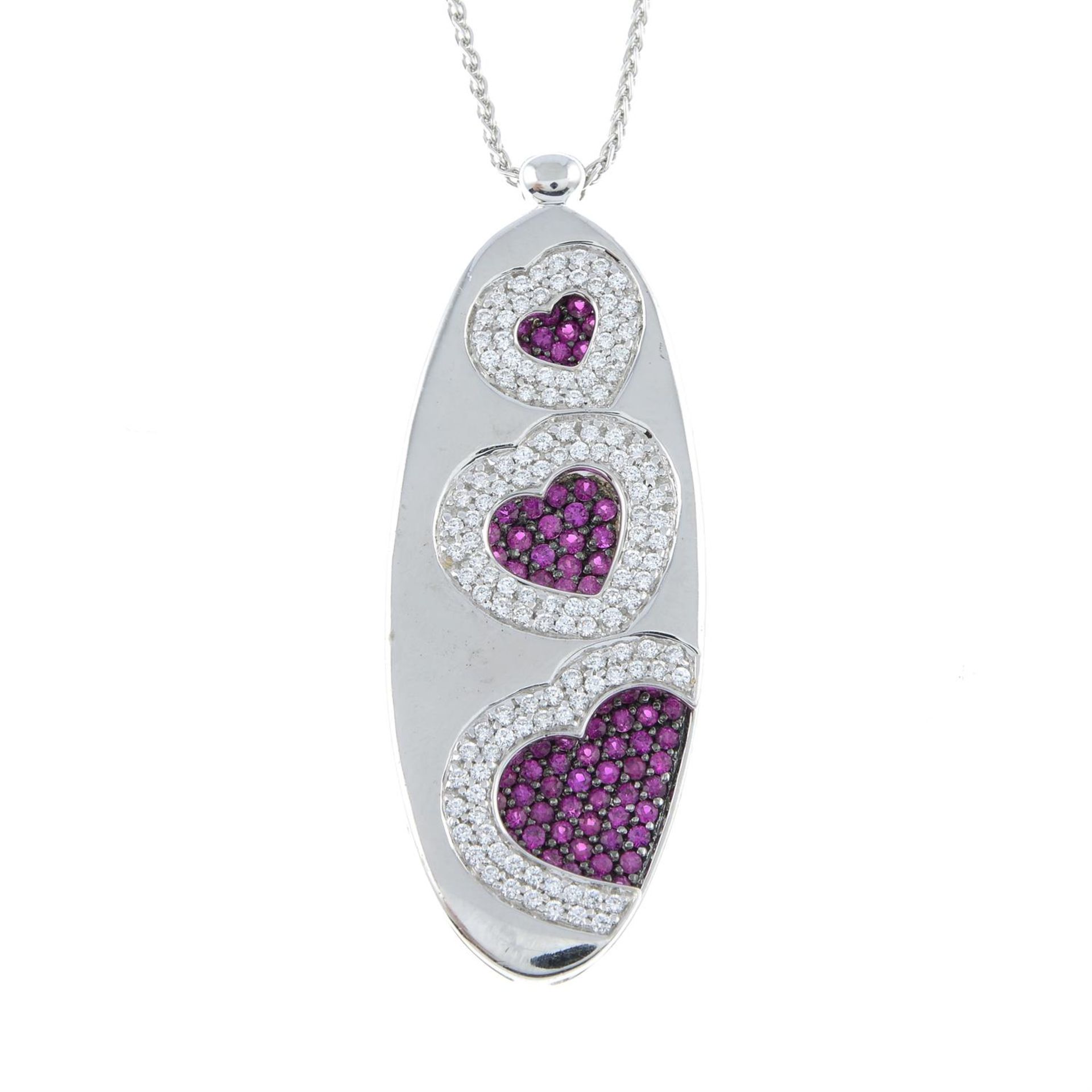 A pavé-set pink sapphire and diamond heart pendant, with chain, by Recarlo.