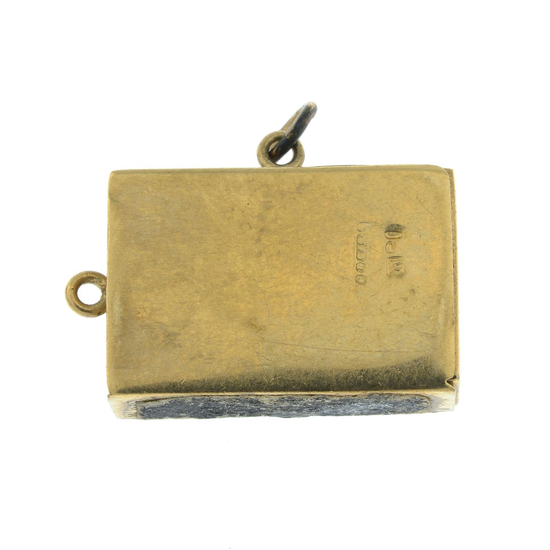 A 9ct gold miniature match box charm, with enamel detail. - Image 2 of 3