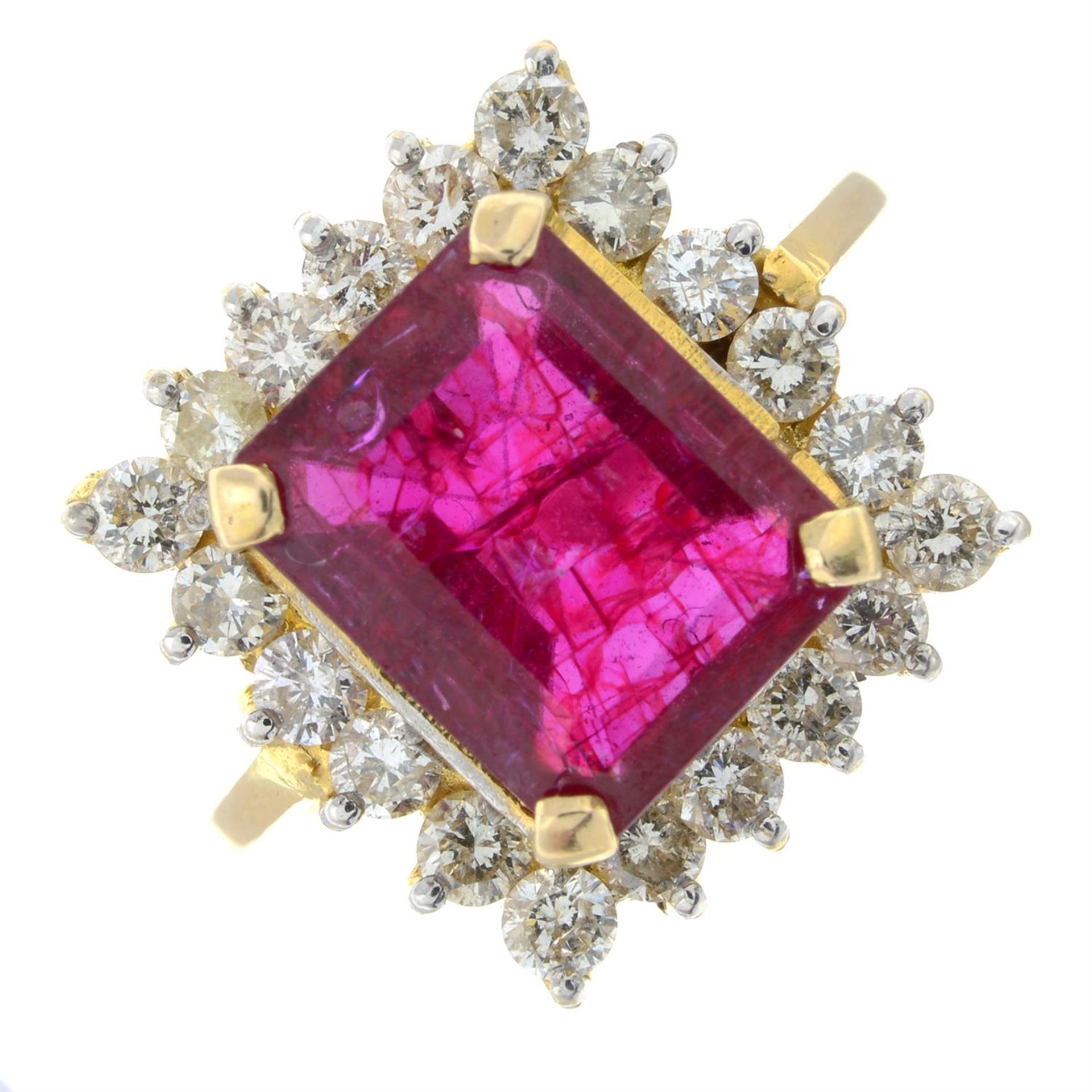 A synthetic ruby and brilliant-cut diamond cluster ring.