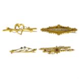 Four late 19th to early 20th century gold brooches.